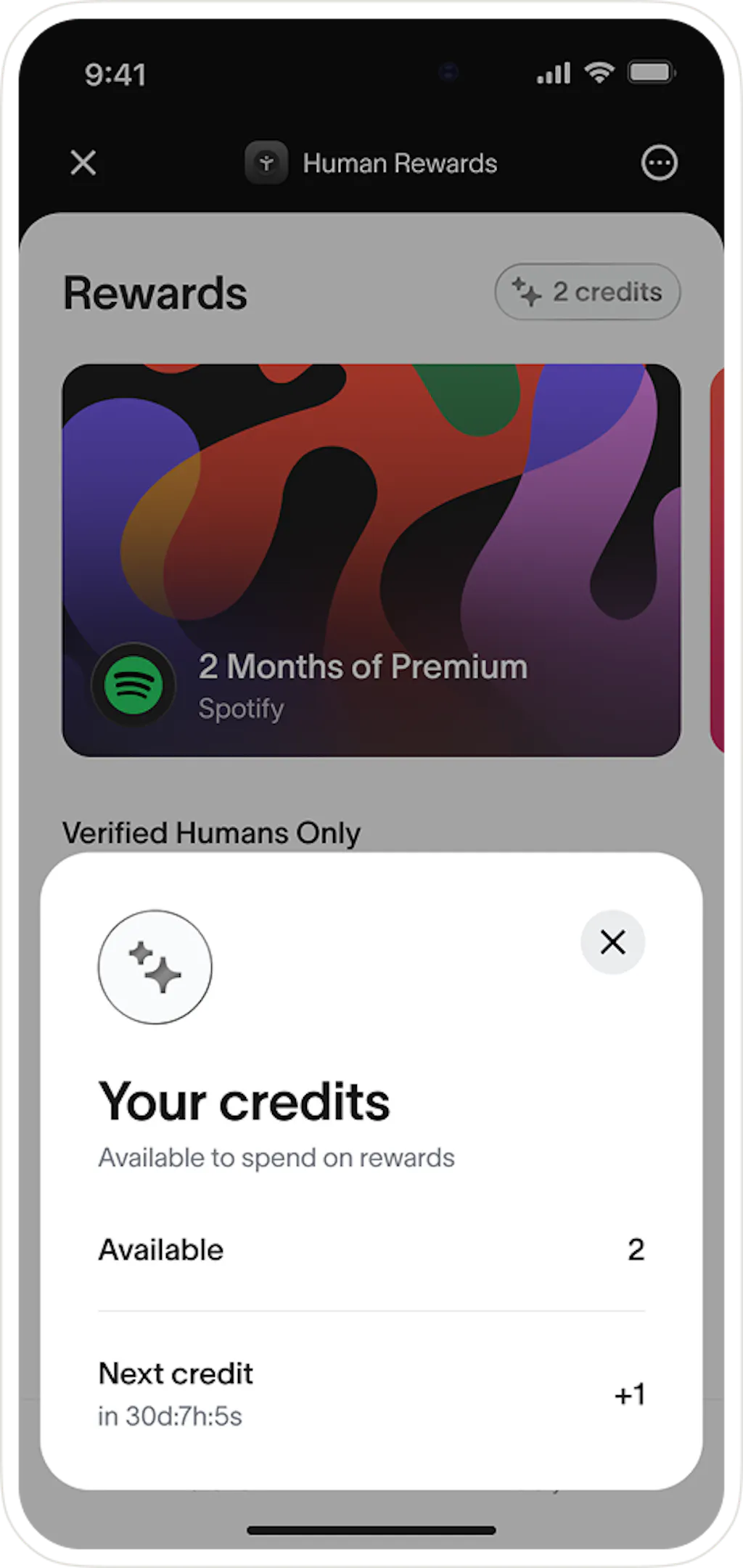 Screen showing 'Human Rewards' with available credits and Spotify offer for verified users.