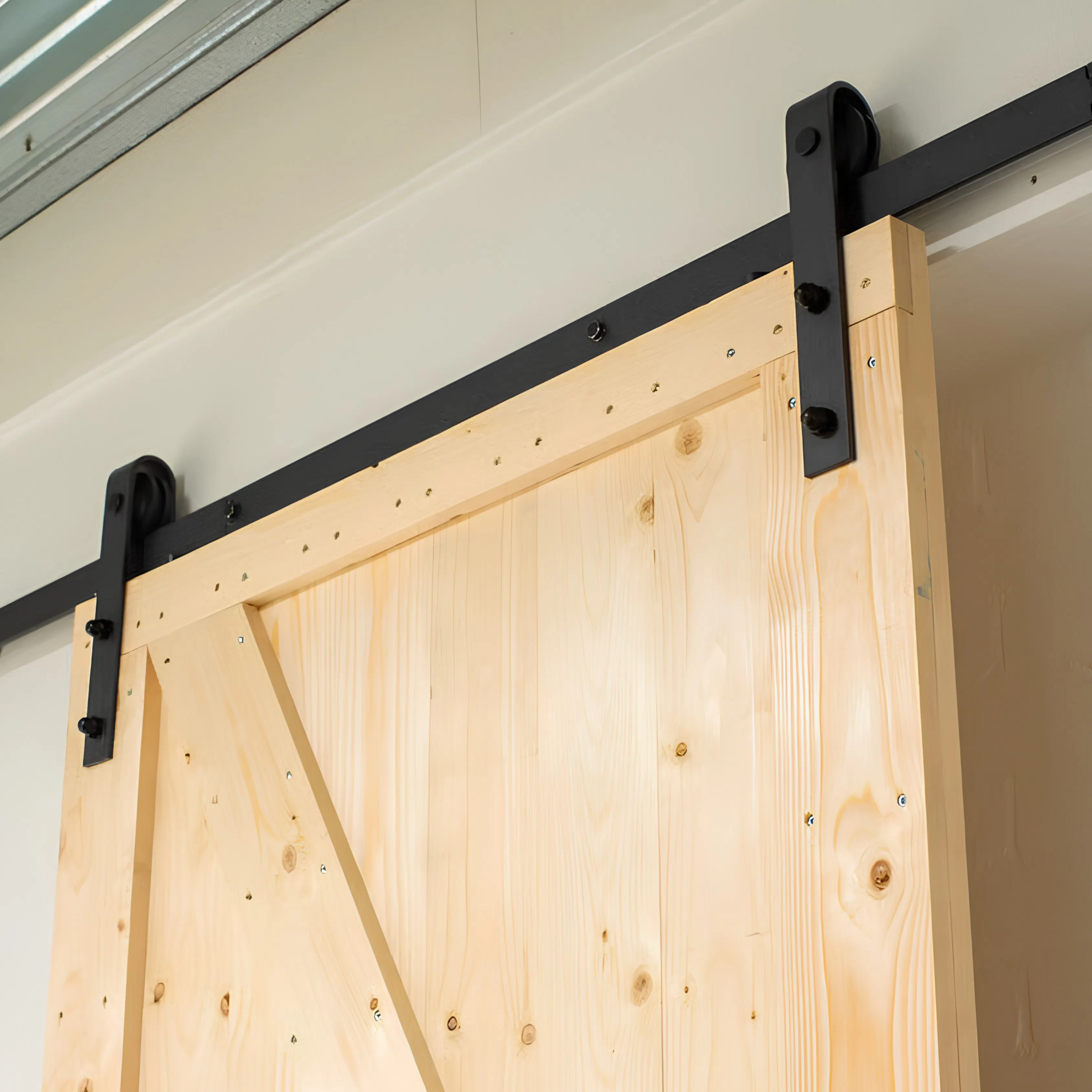Bovenlopend wandsysteem loftdeur