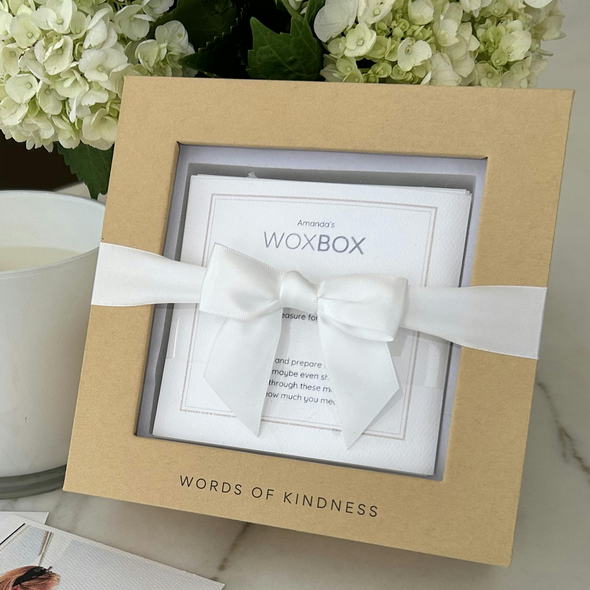 The ultimate feel-good gift with white ribbon, by Woxbox