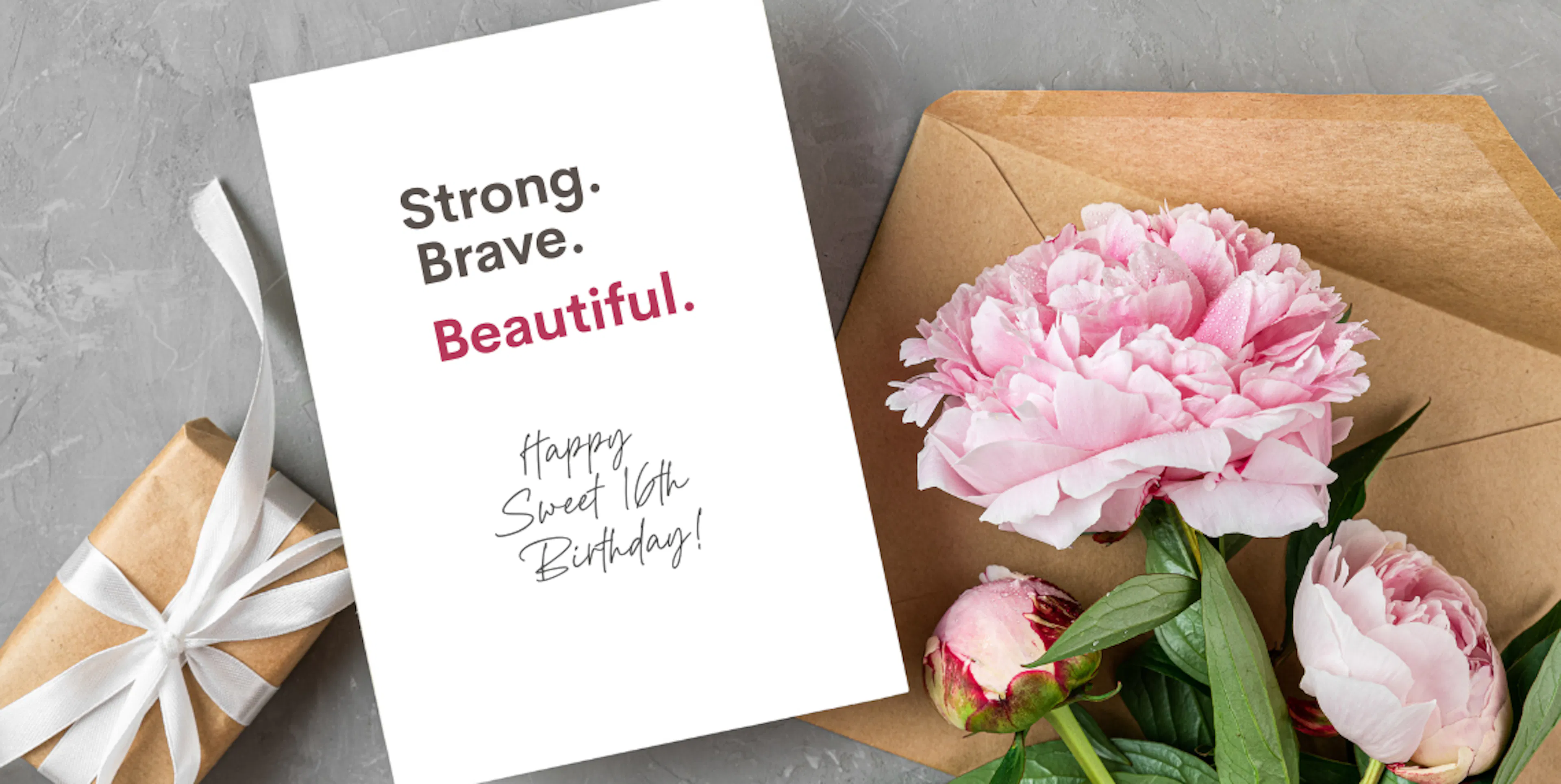 Sweet 16 birthday gift with flowers and a card that reads "Strong. Brave. Beautiful. Happy Sweet 16th Birthday!"