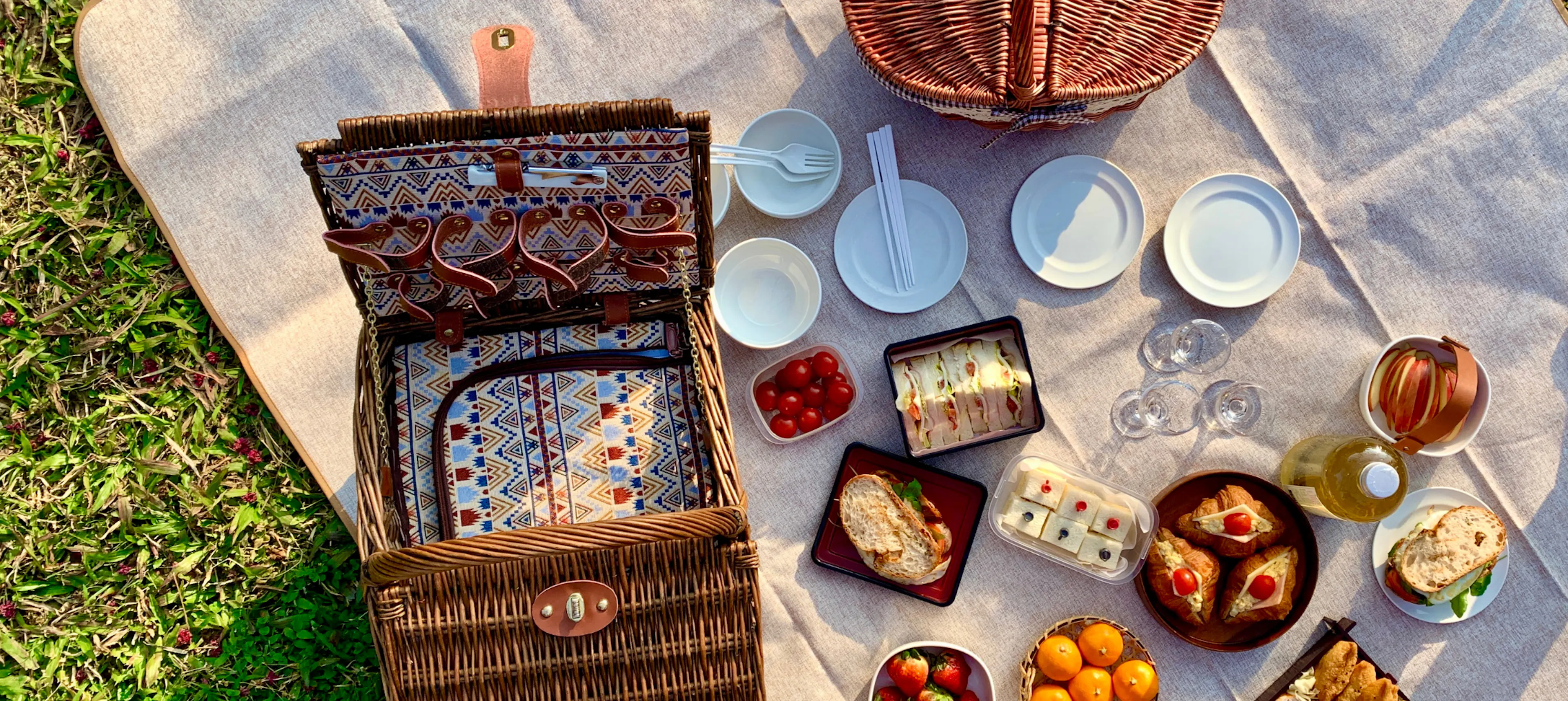 Picnic basket and food for a family picnic summer tradition