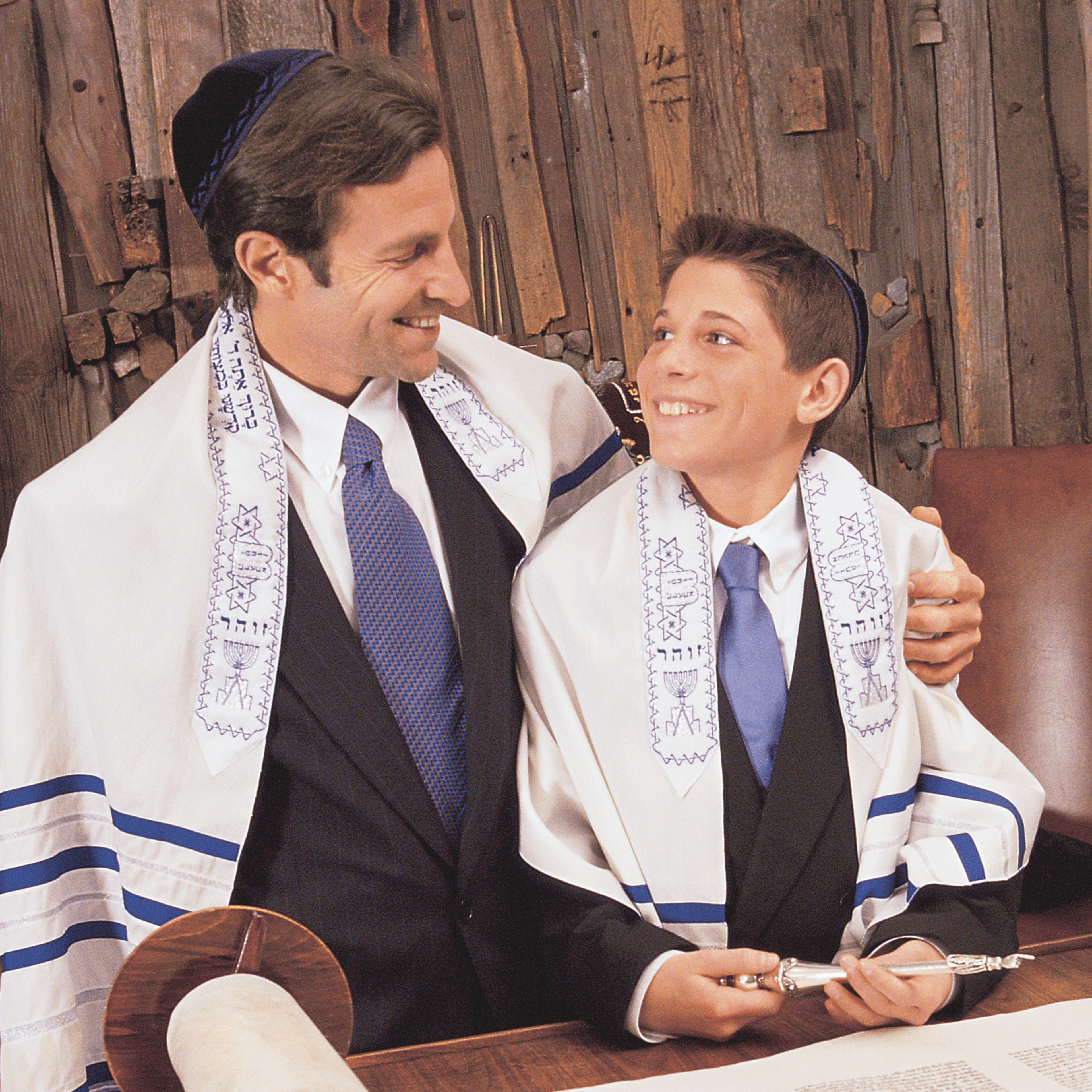 Young man looking up at his father on his Bar Mitzvah day, by Woxbox Gift