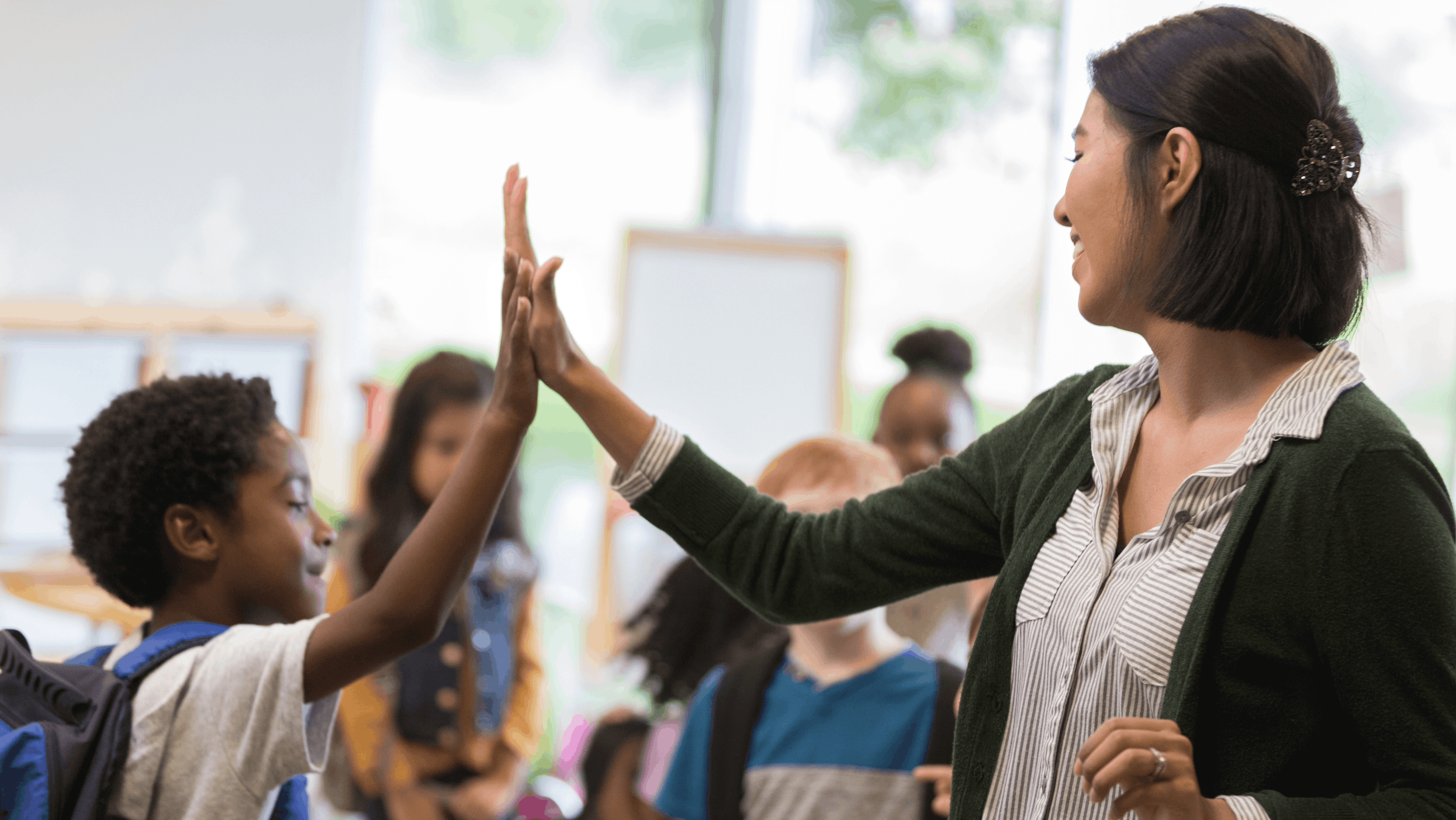 Teacher giving student a high five, by Woxbox Gift