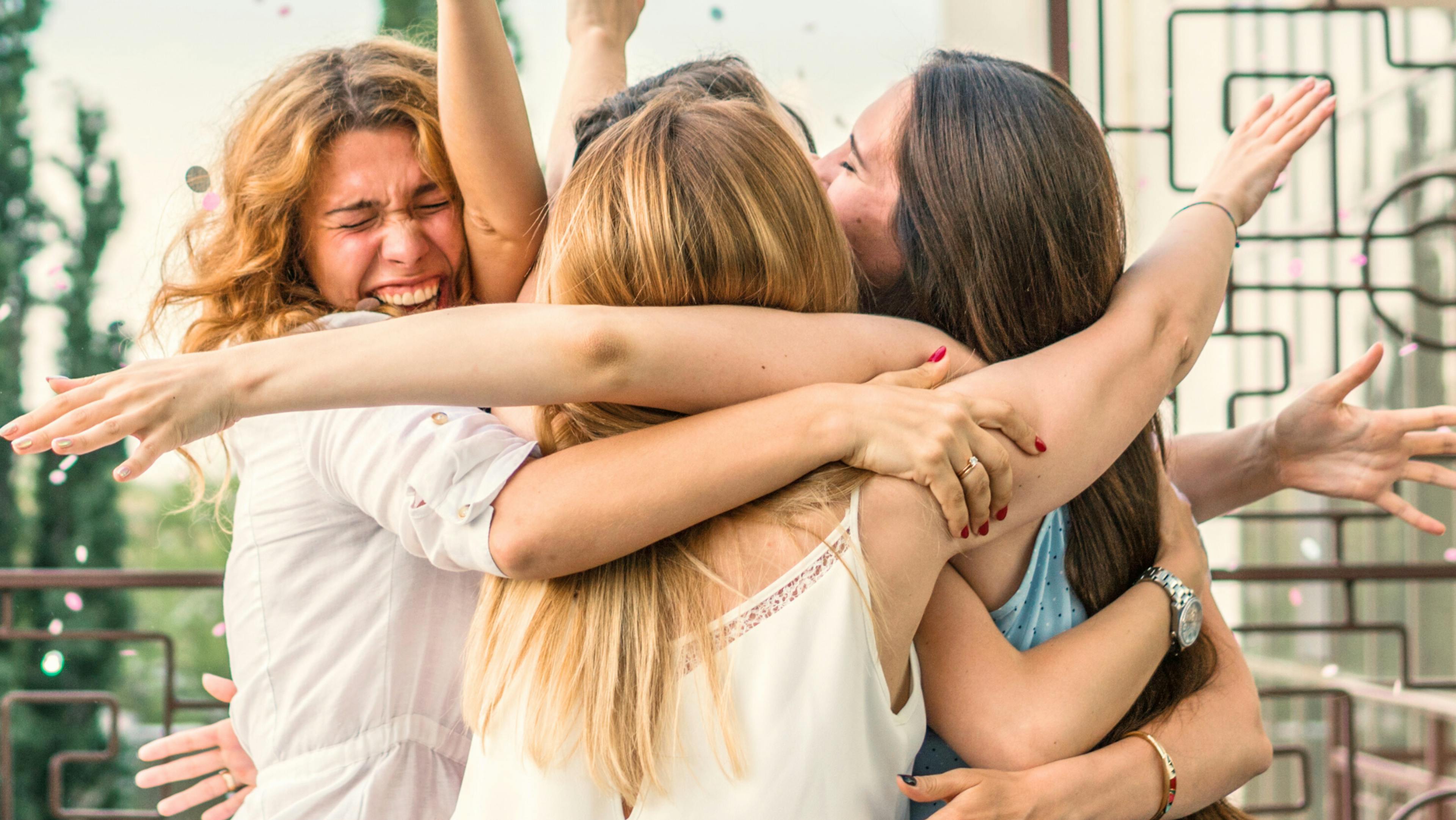 Group of girl friends celebrating a milestone birthday and receiving the perfect gift of a Woxbox