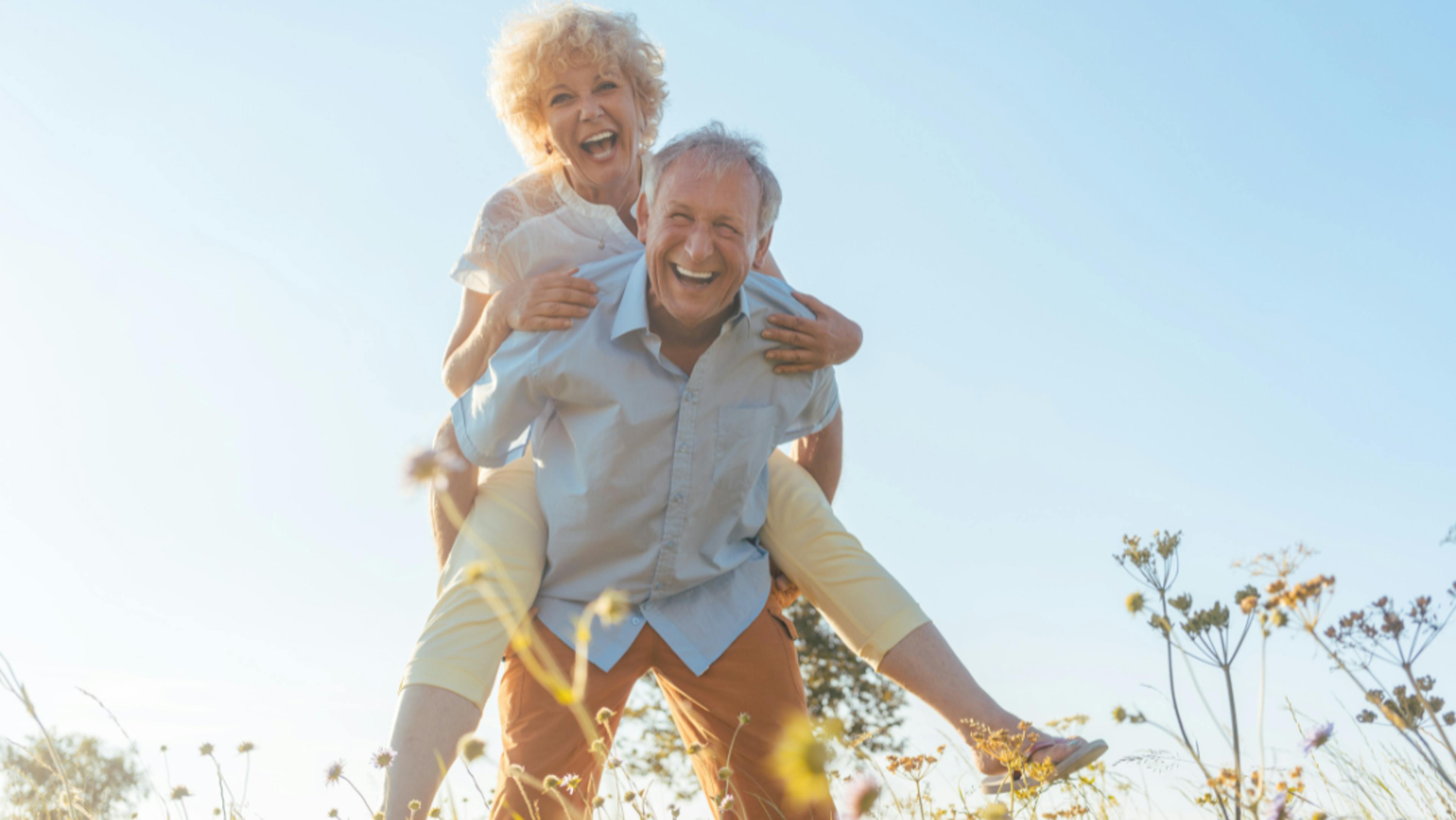 Loving couple laughing on their golden anniversary, by Woxbox Gift