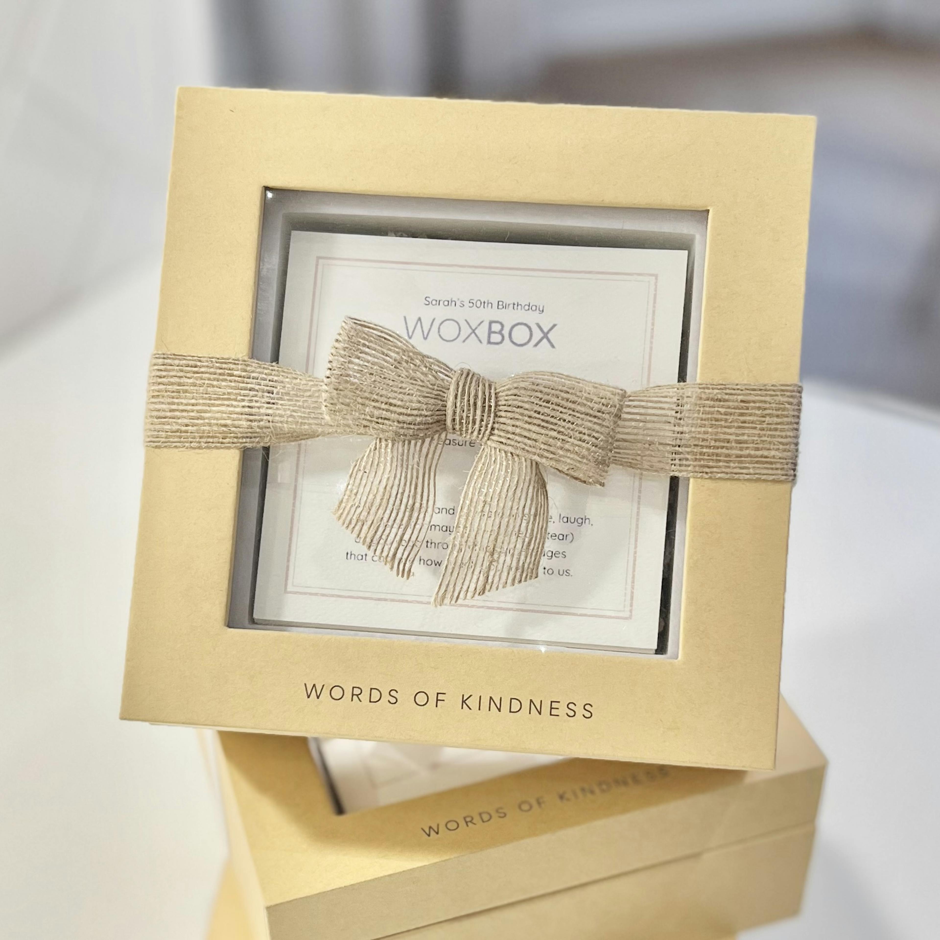 Woxbox Gift with a silver-thread jute ribbon