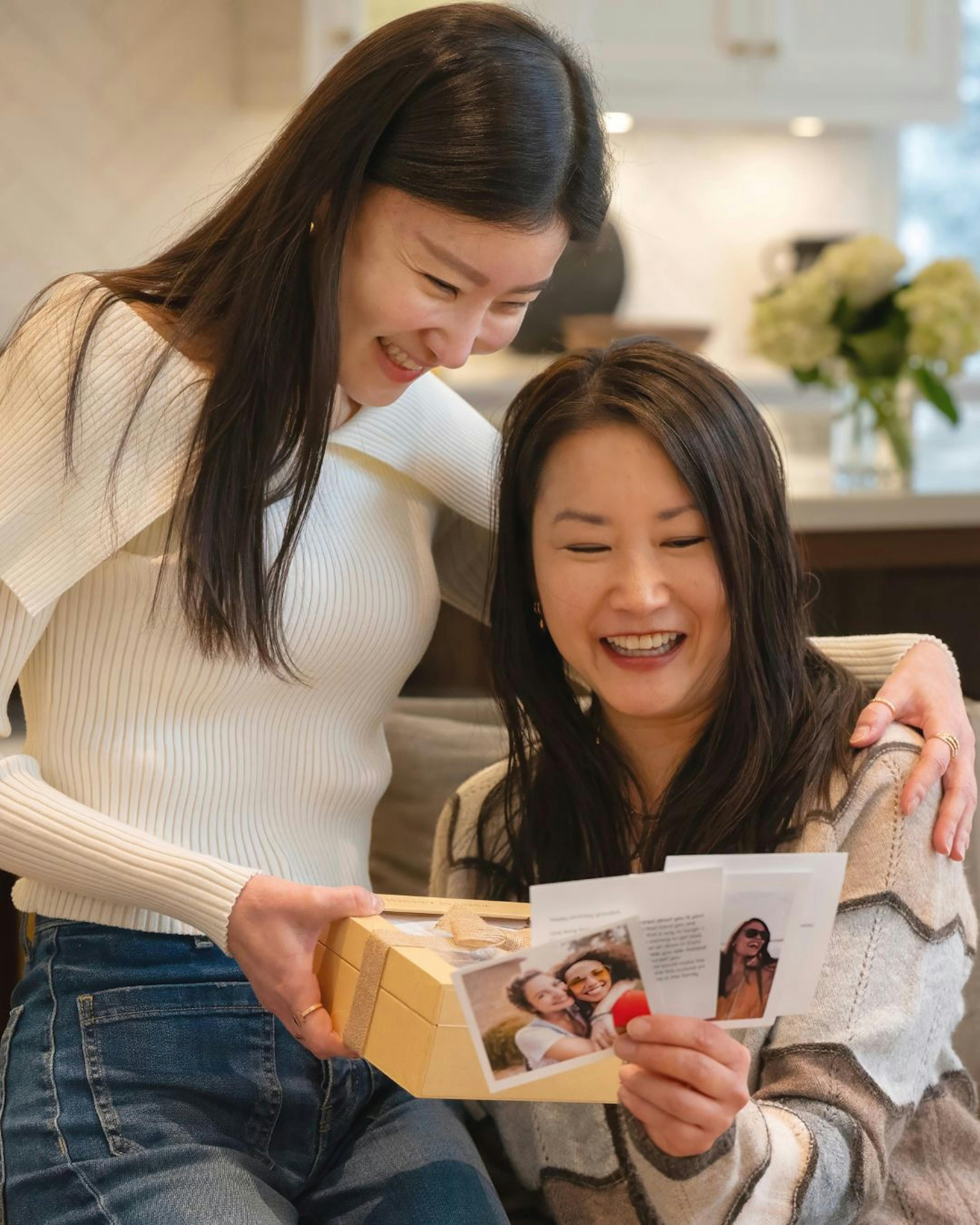 Friend opening her Woxbox gift and reading the heartfelt messages
