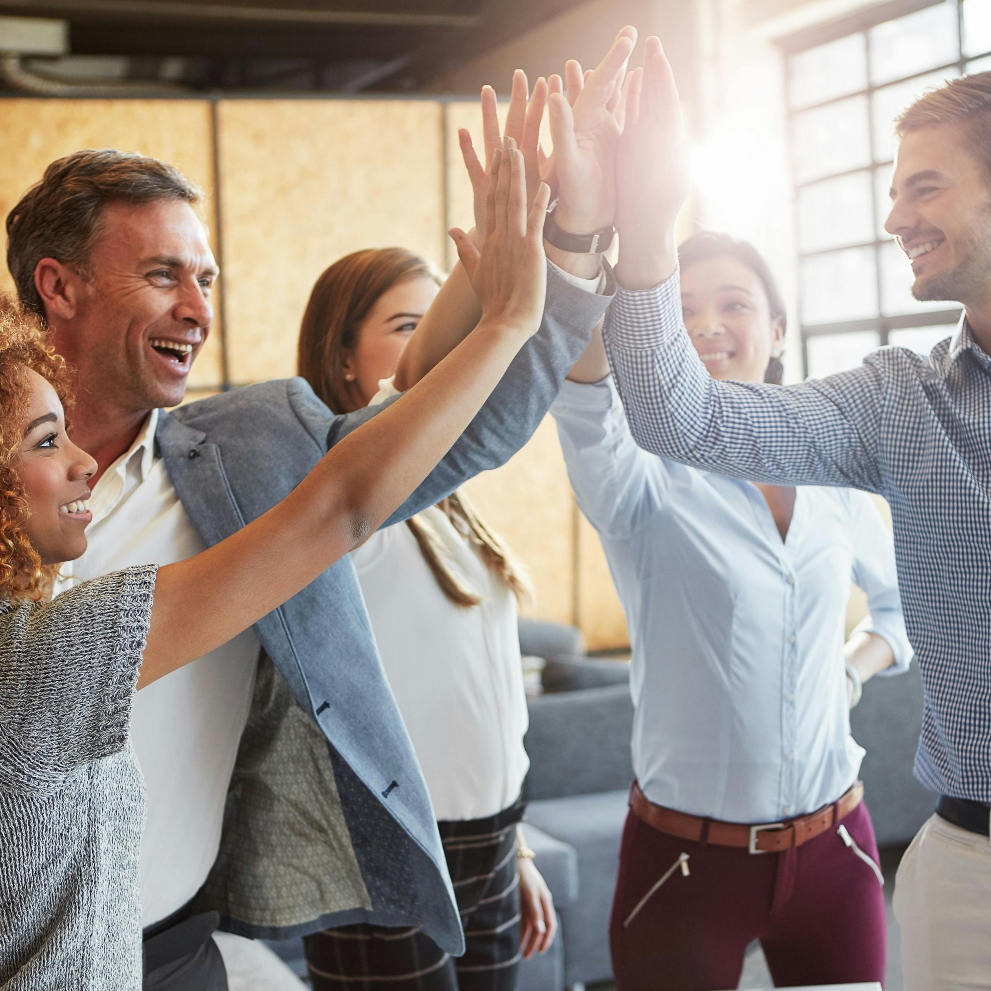 Team members contributing personal messages for employee appreciation gift