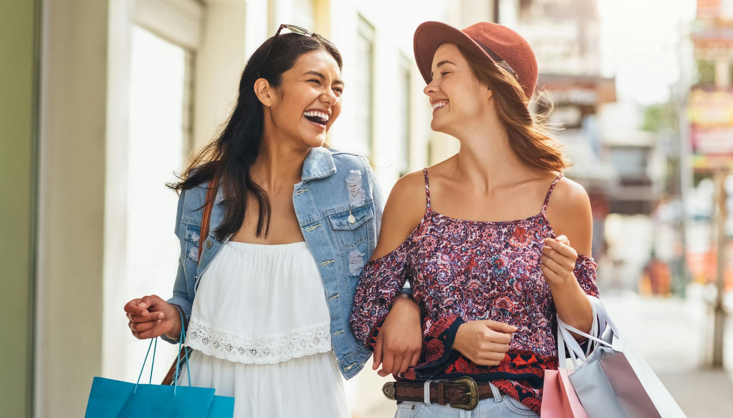 Buying a gift for her best friend while shopping and laughing