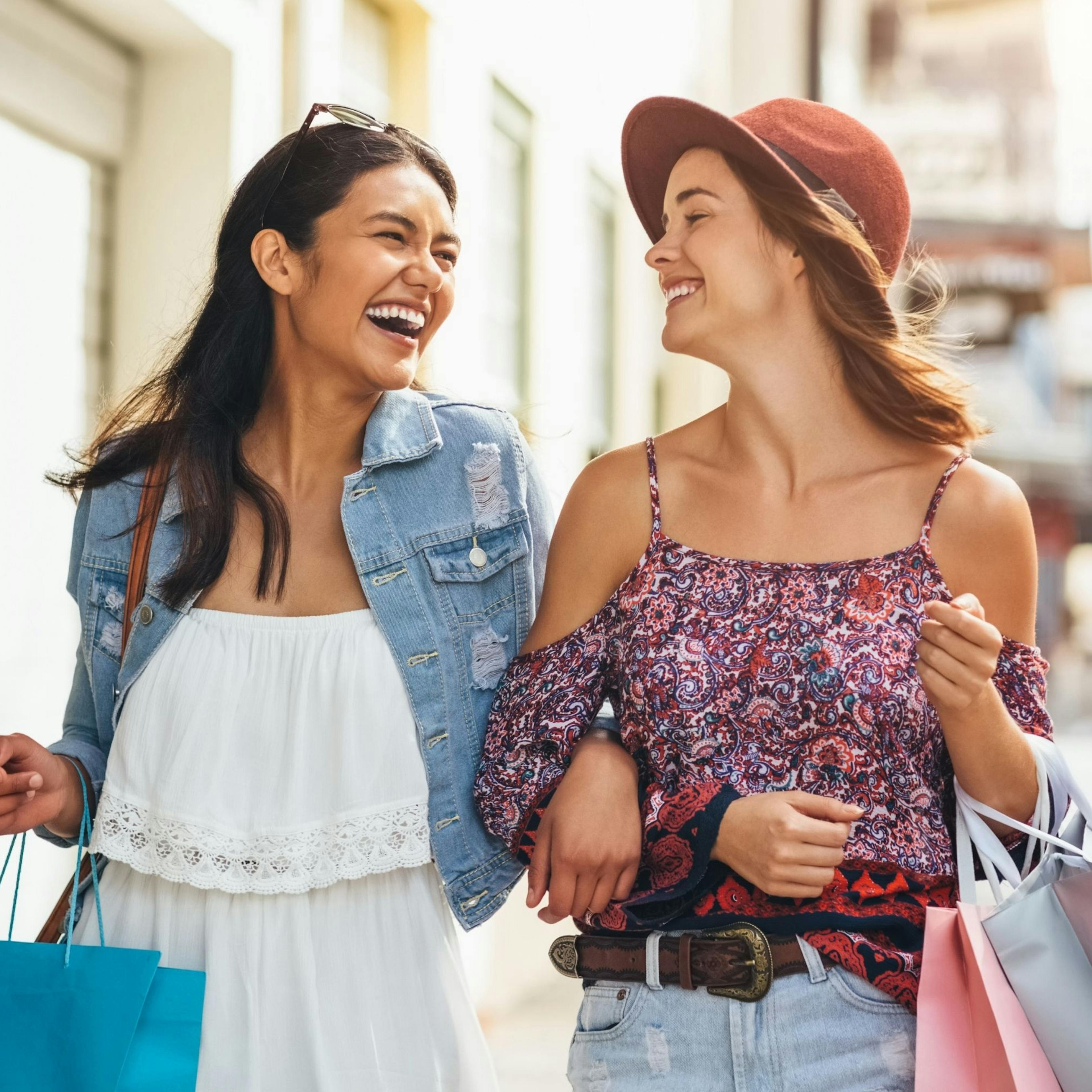 Buying a gift for her best friend while shopping and laughing