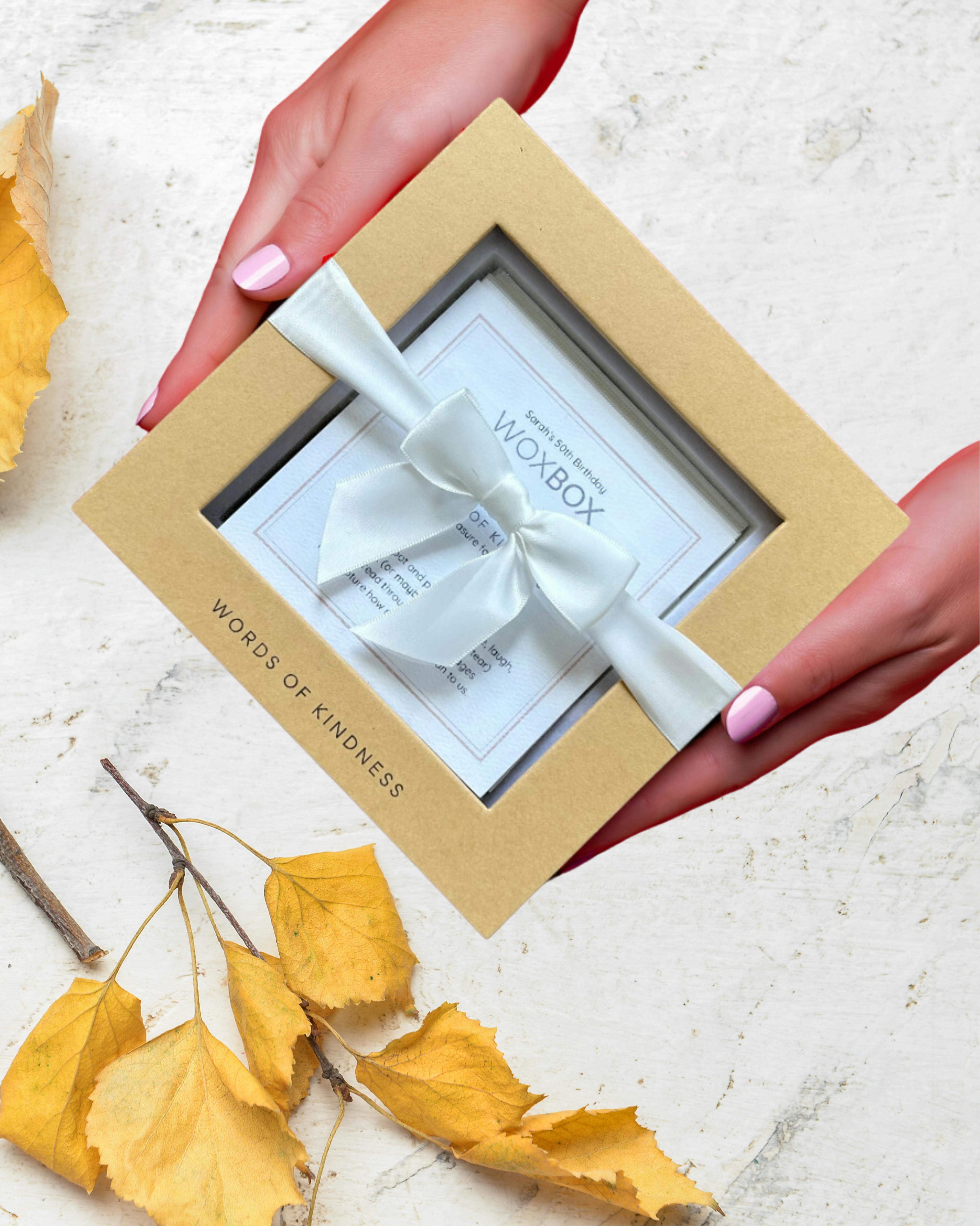 Woxbox keepsake gift filled with a personal collection of messages and photos printed on luxury cardstock