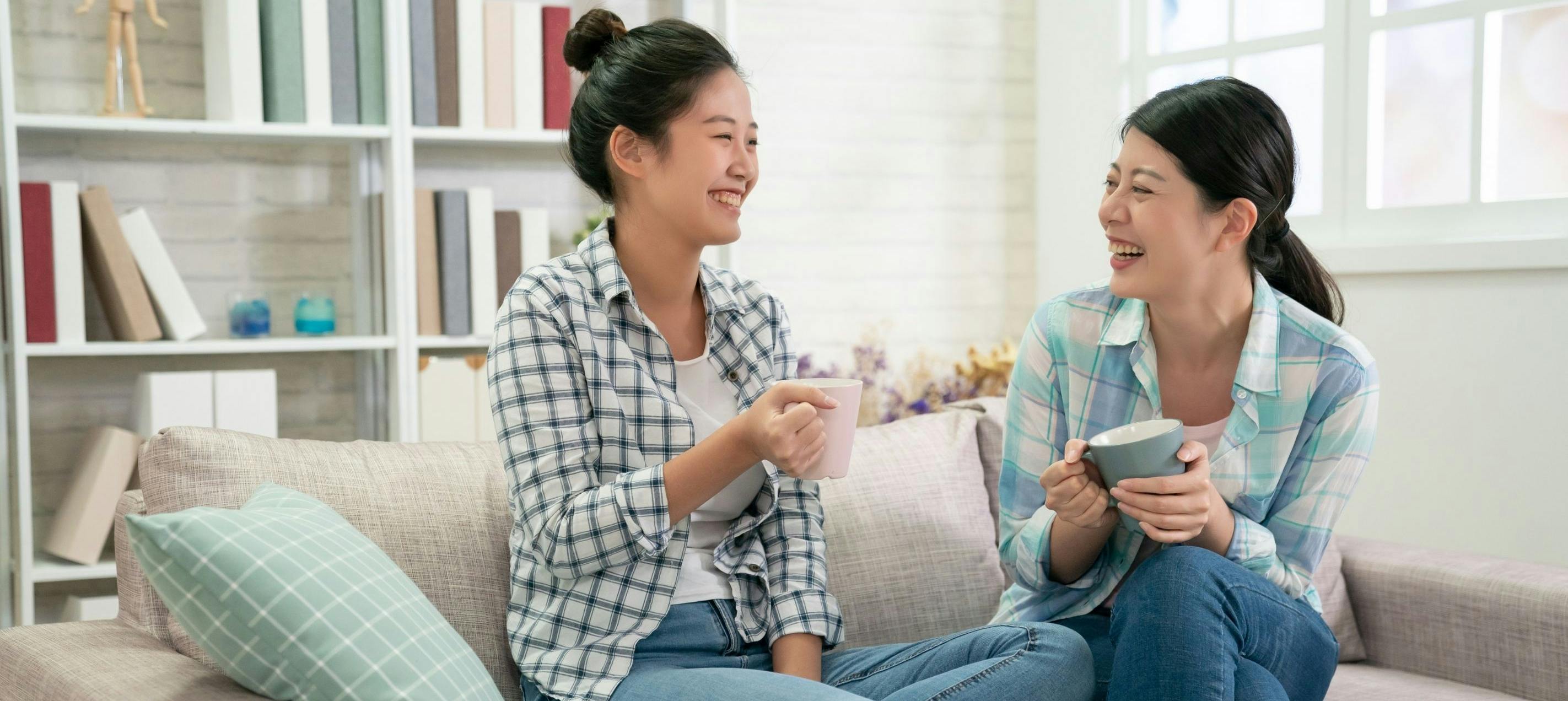 Two friends having meaningful conversation over coffee, demonstrating active listening and connection