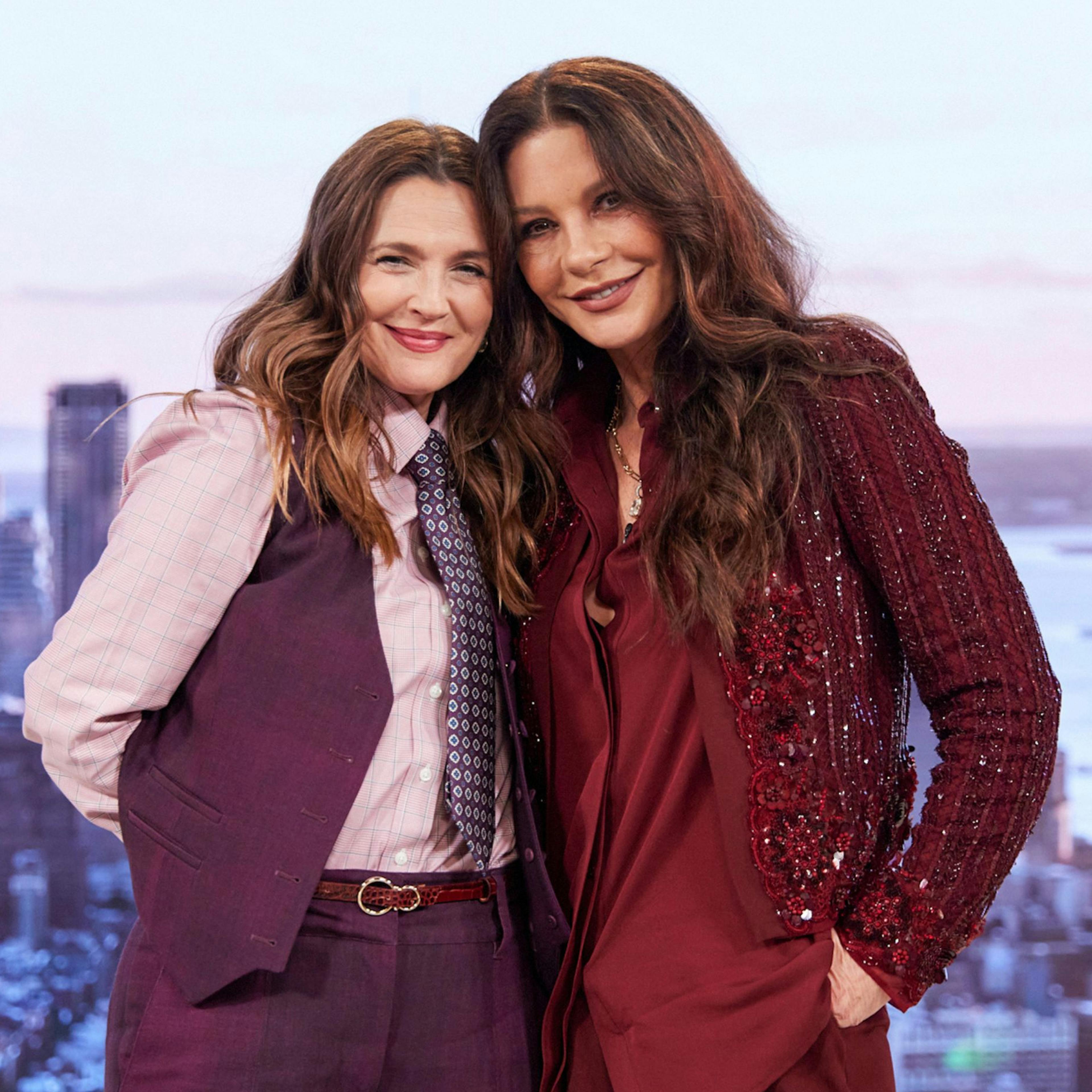 Drew Barrymore and Catherine Zeta Jones on the Drew Barrymore Show giving each other a hug