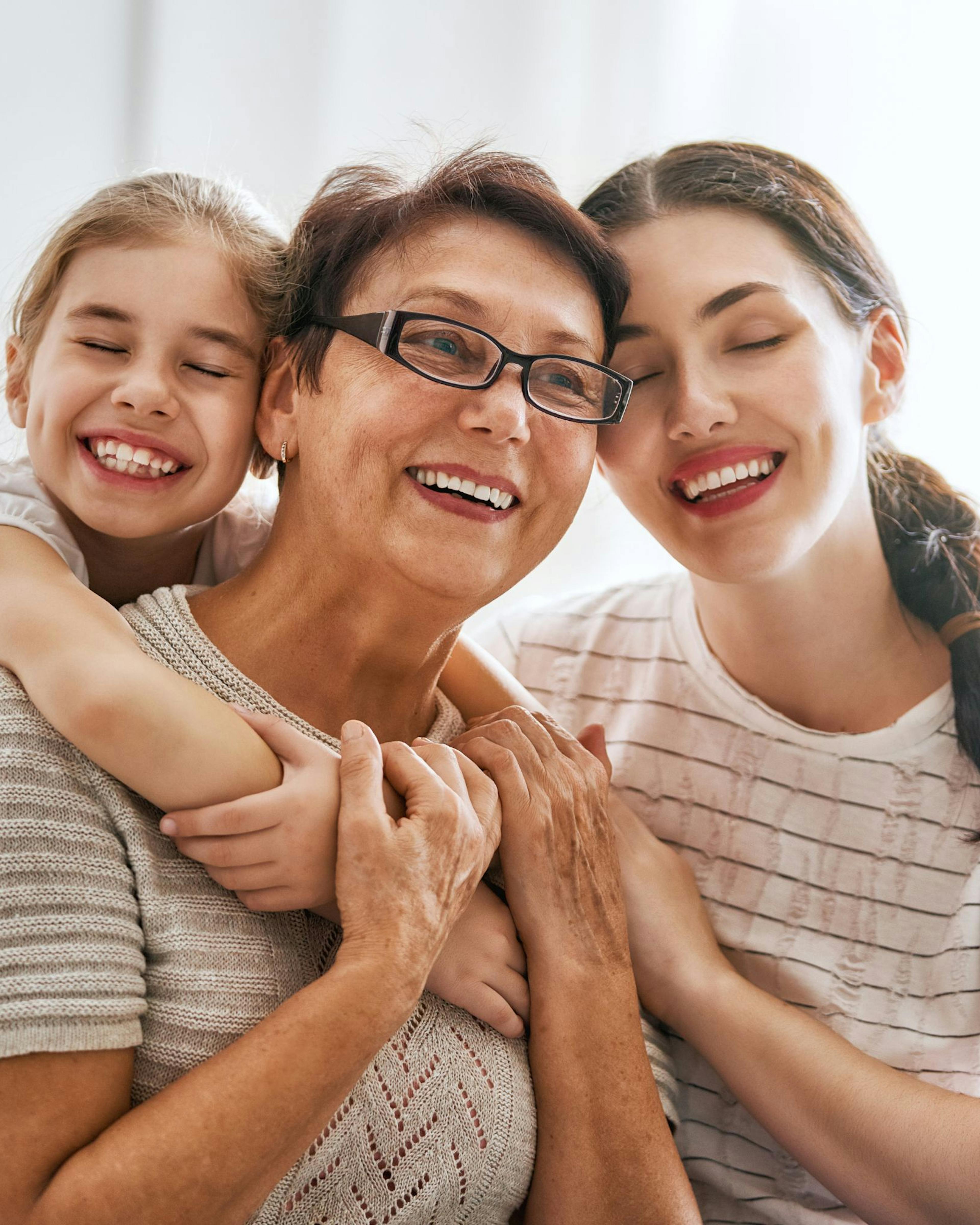 Three generations hugging Mom on Mother's Day