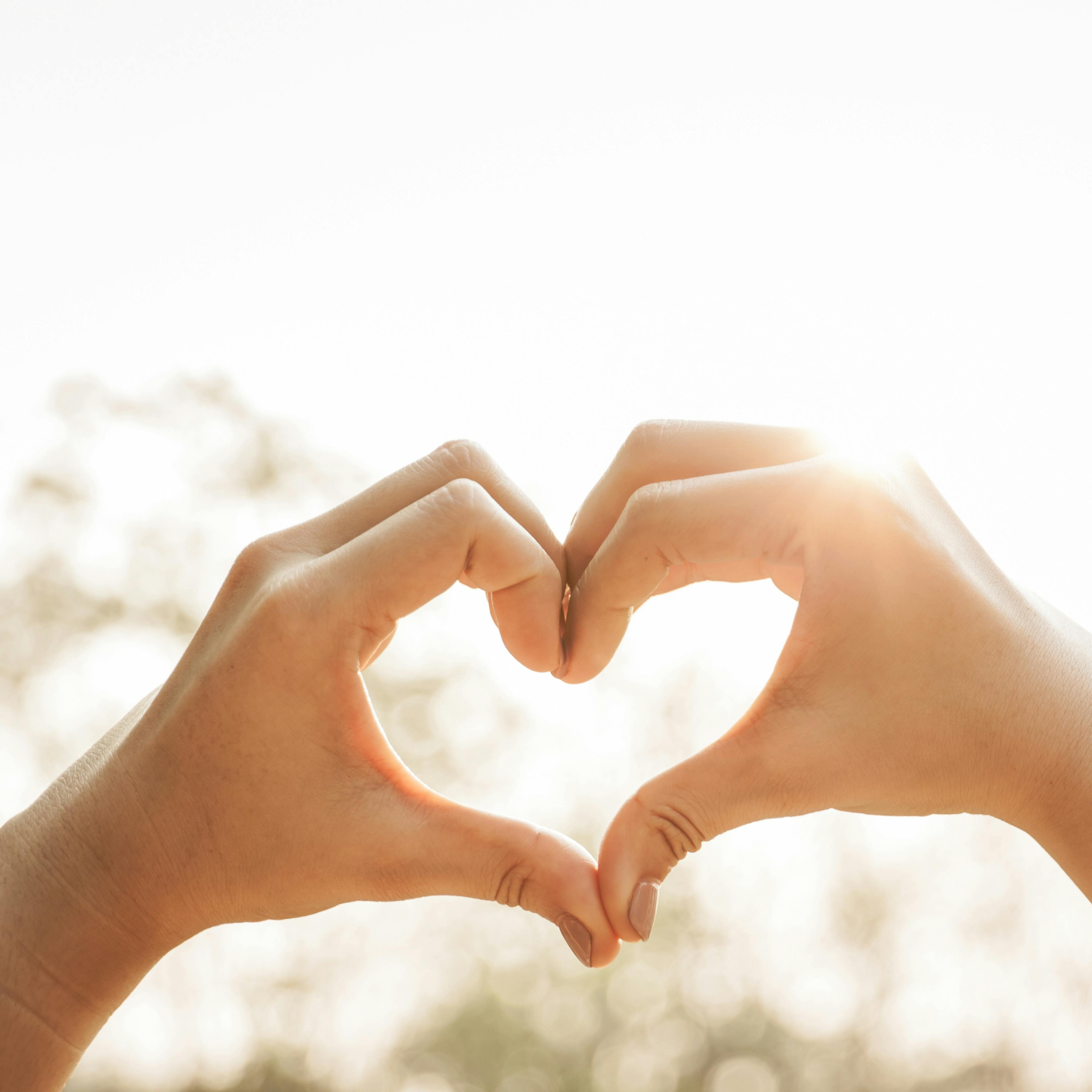 Hands forming a heart, representing  meaningful family connections and gratitude