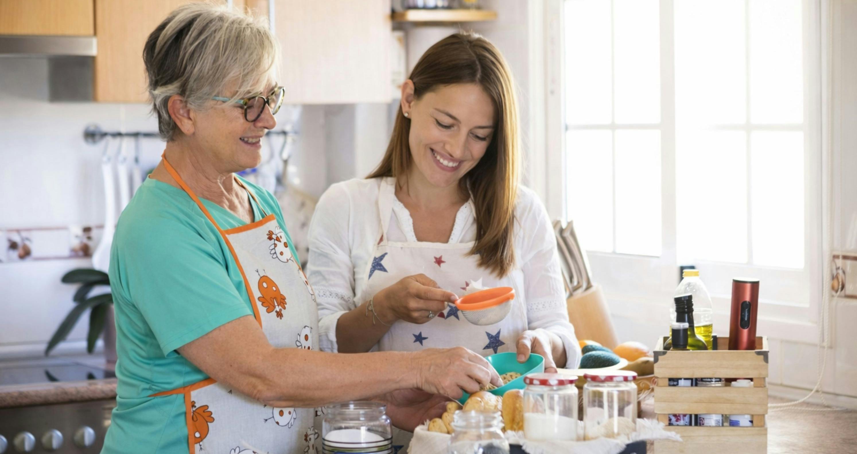 Mother and daughter enjoying a Mother's Day gift of a cooking class together