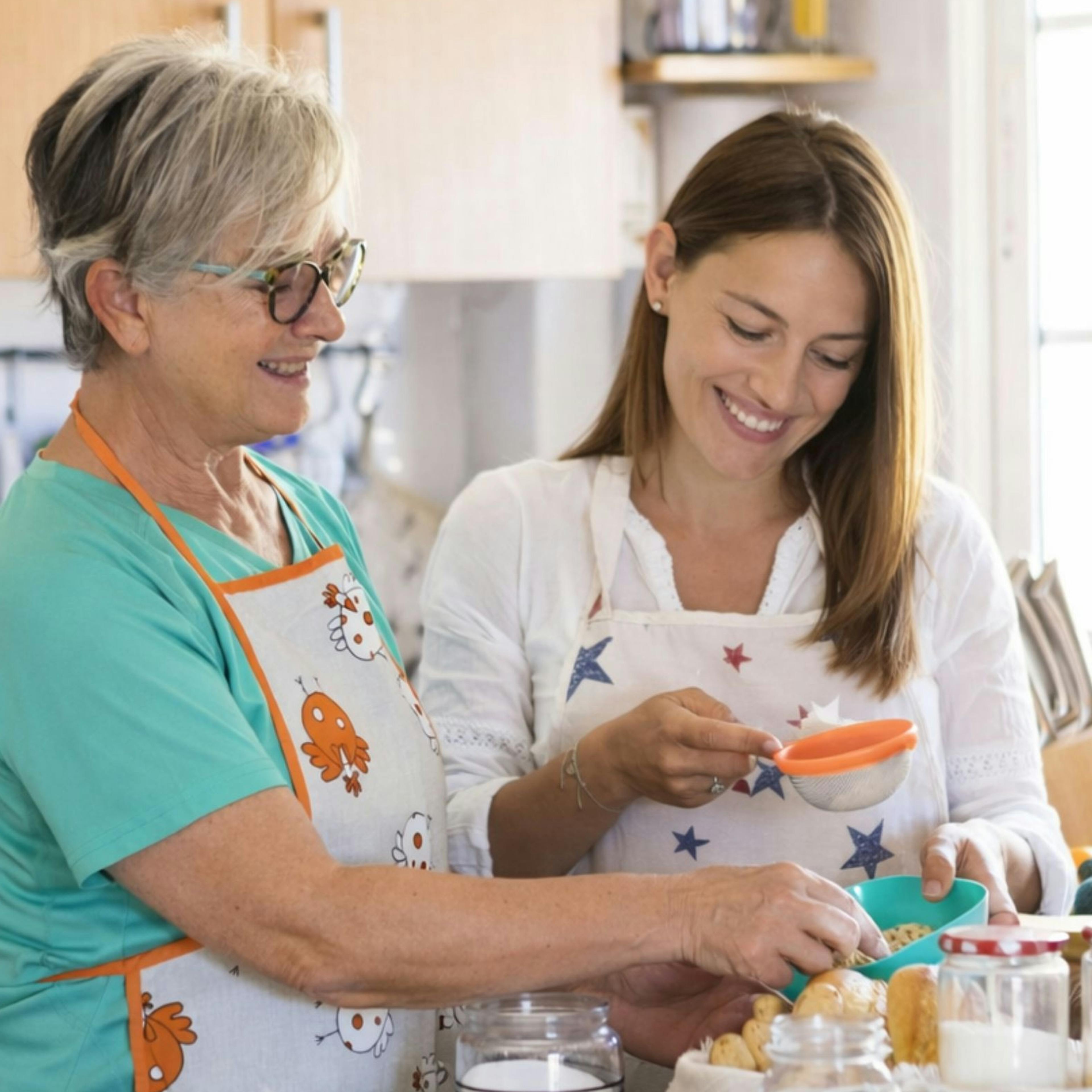 Mother and daughter enjoying a Mother's Day gift of a cooking class together