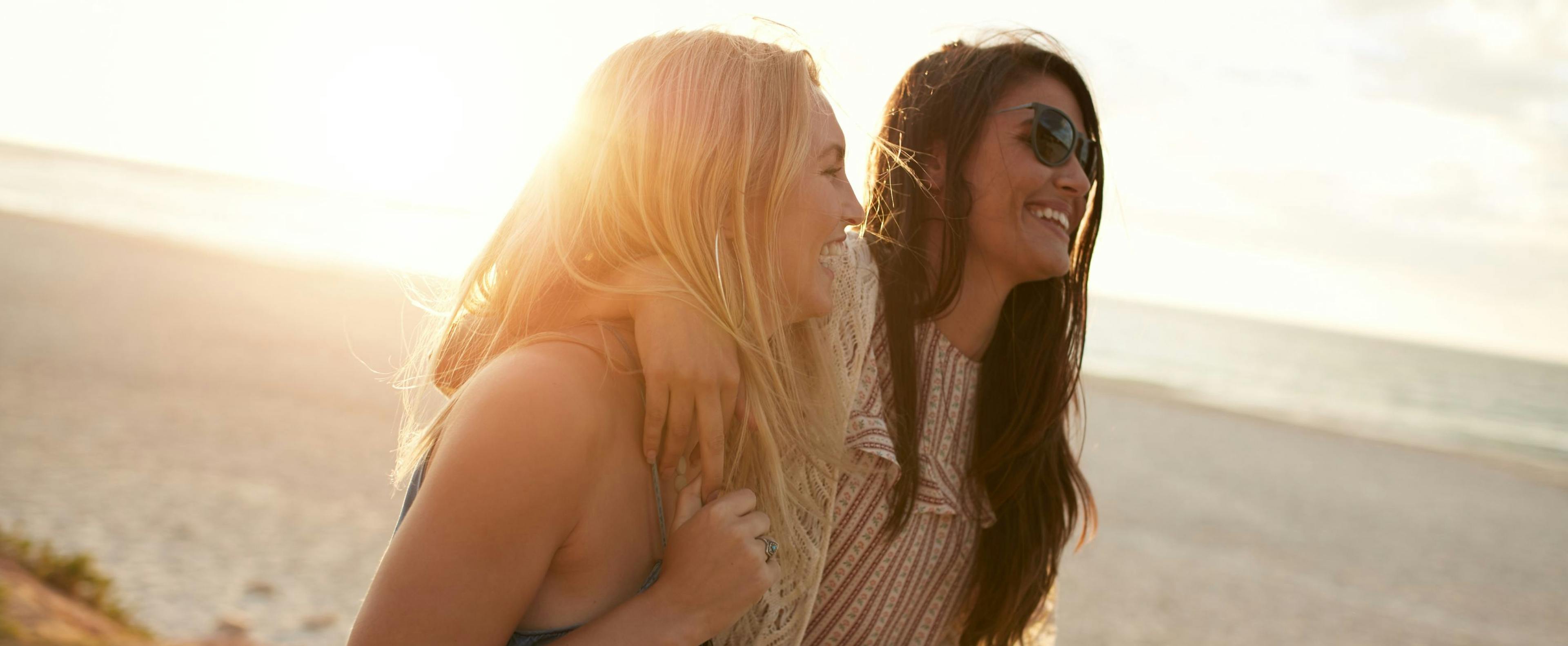 Two friends enjoying time laughing together for Galentine's Day celebration