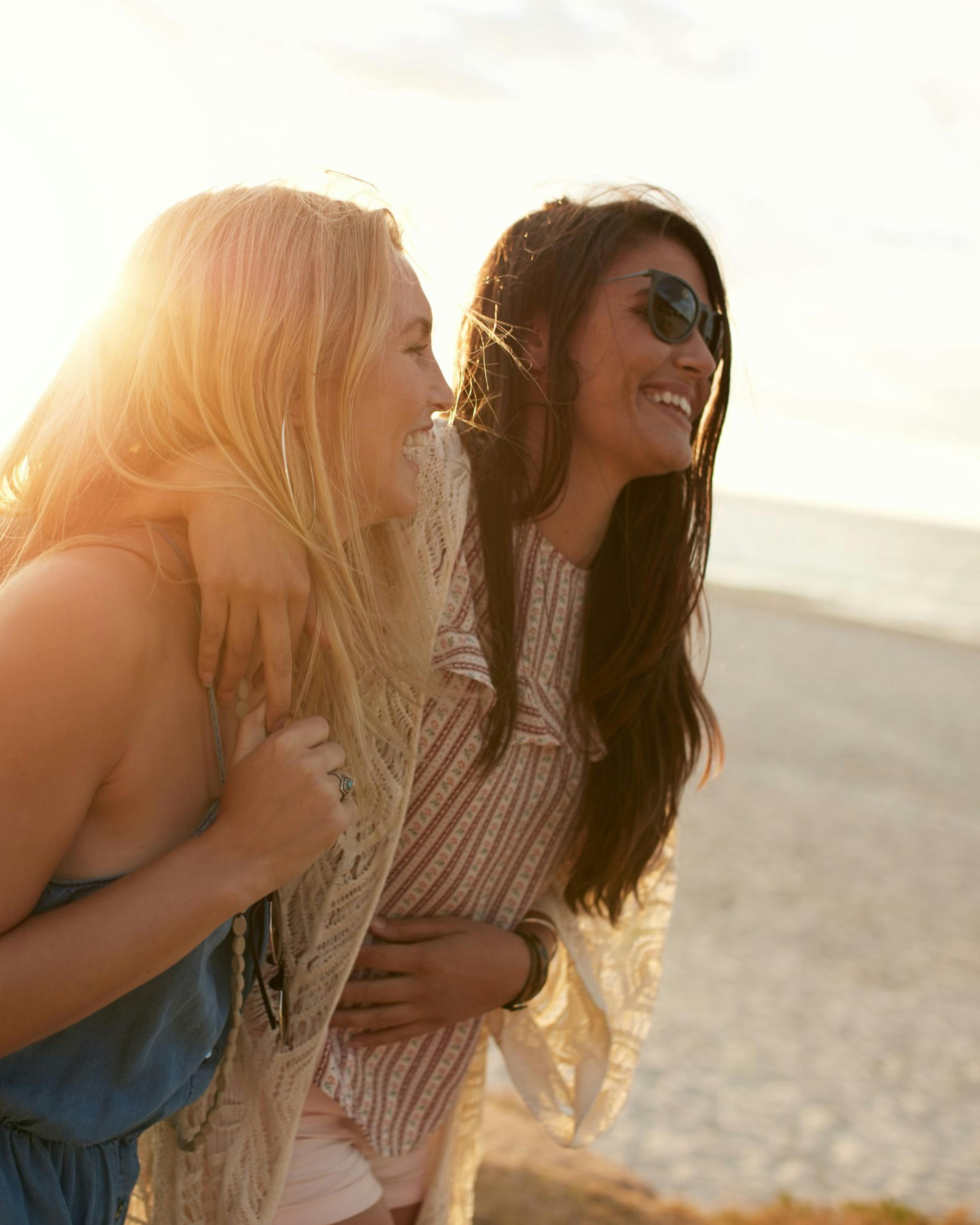 Two friends enjoying time laughing together for Galentine's Day celebration