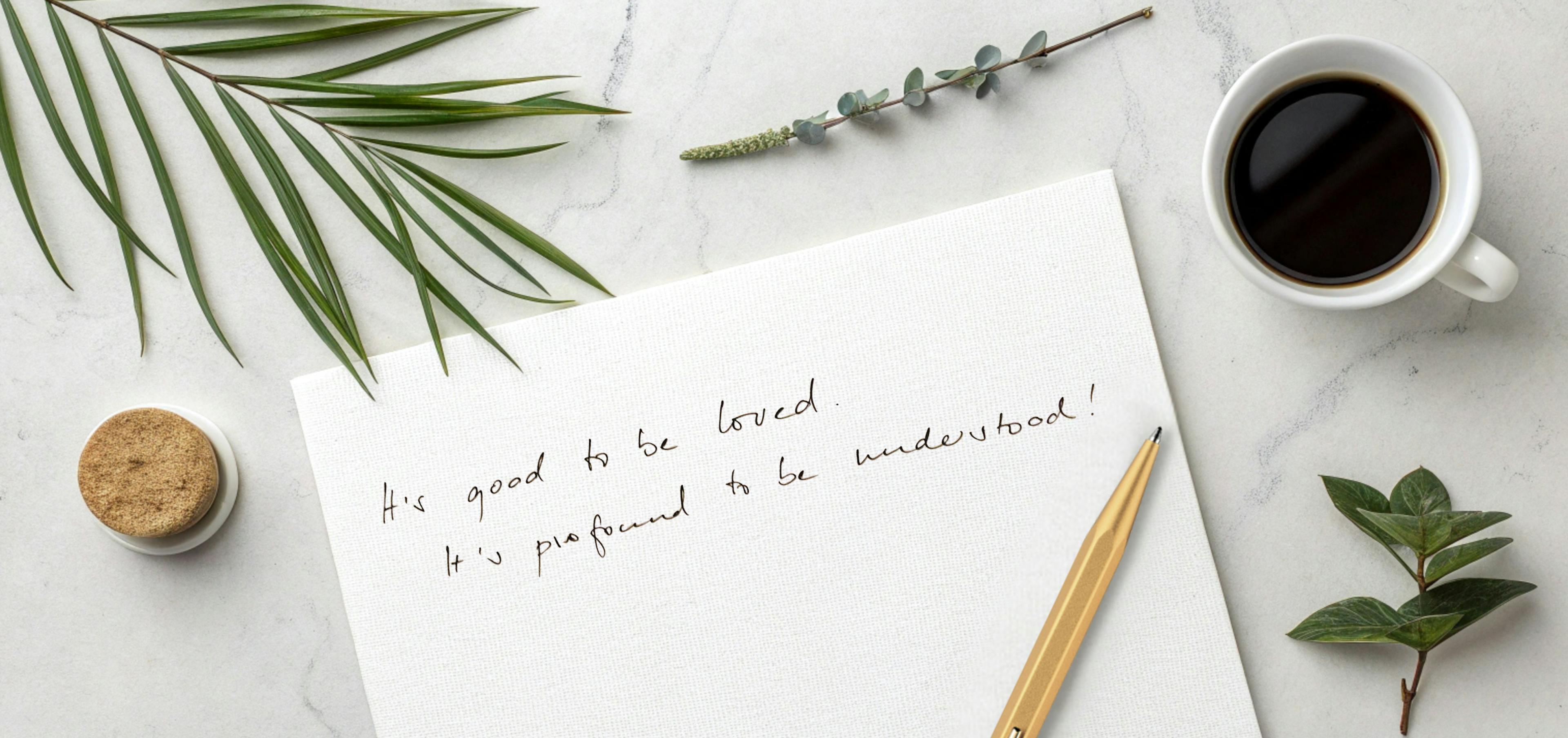 Close-up of handwritten letter with meaningful personal message on paper