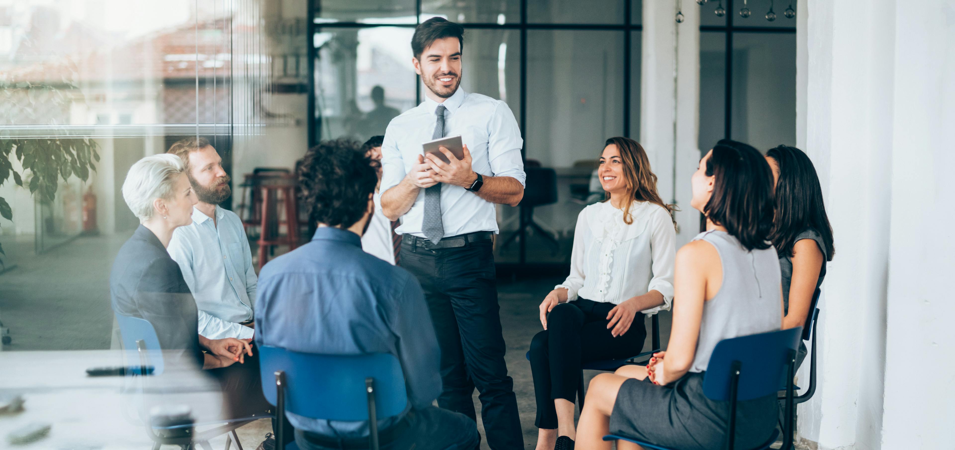 Team members sharing appreciation and kind words in a workplace environment