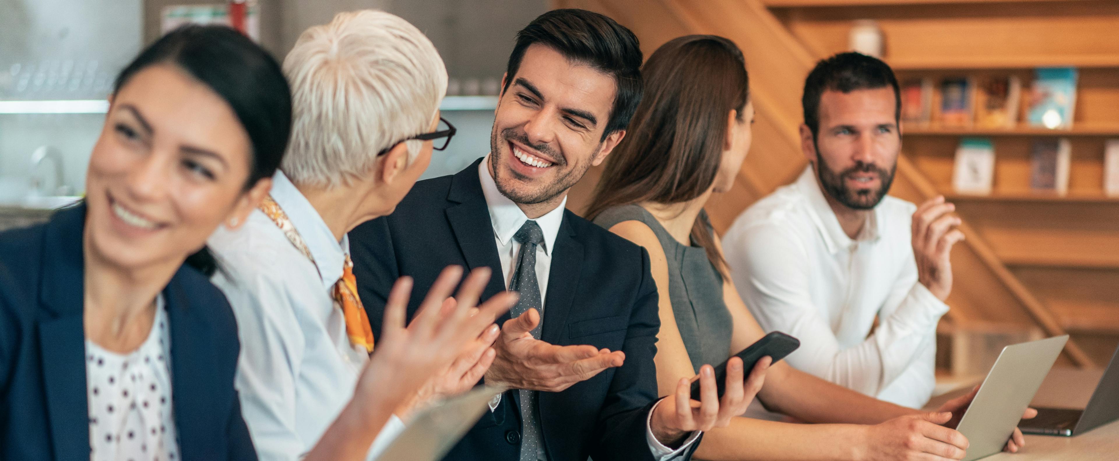 Colleagues discussing a corporate farewell gift