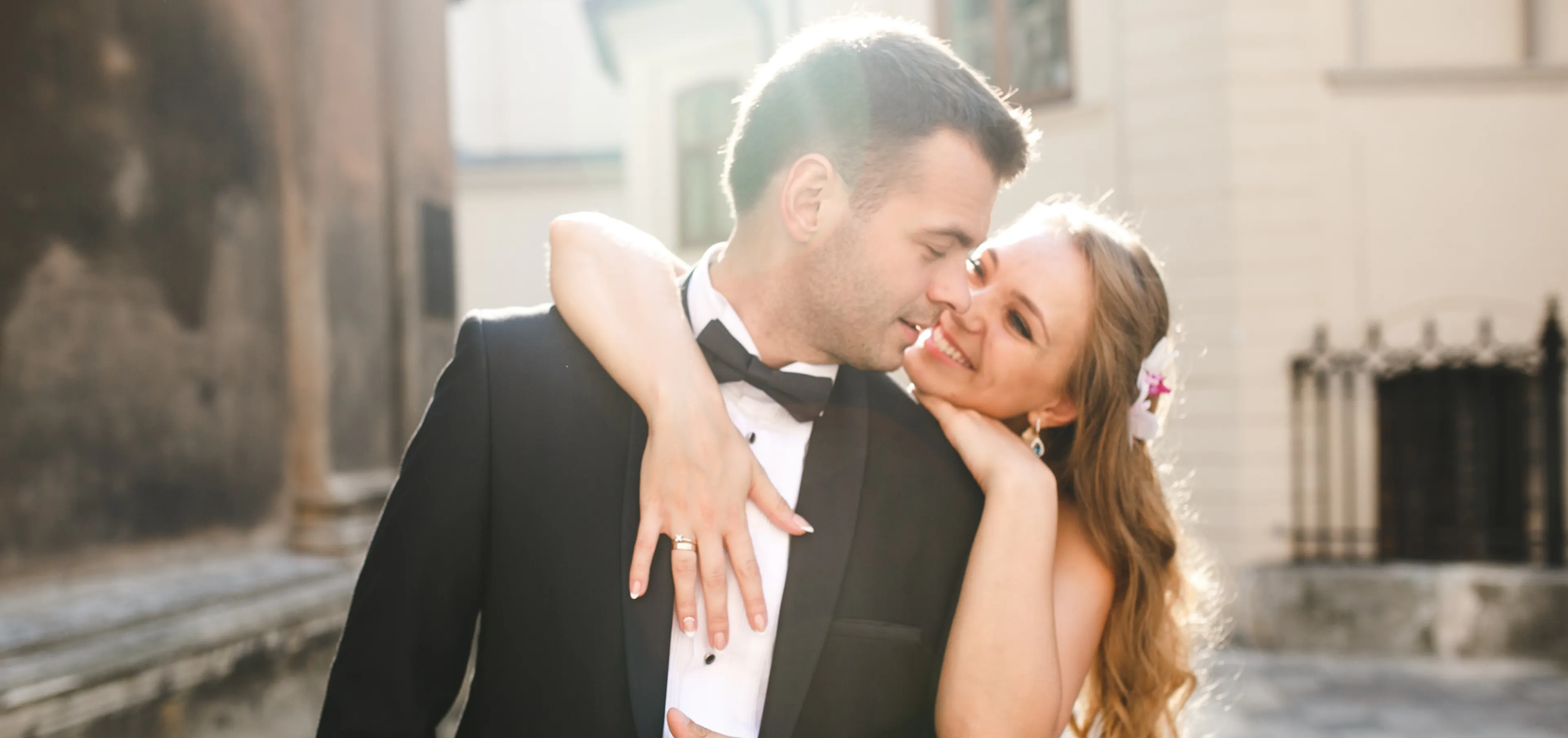 Bride and groom smiling on wedding day