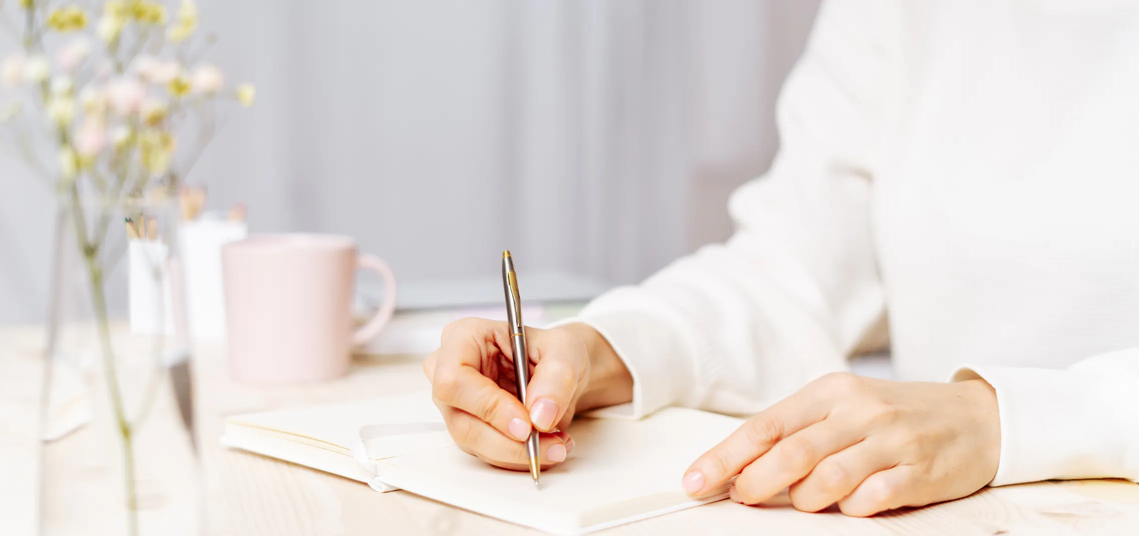 Woman writing a meaningful message in a card
