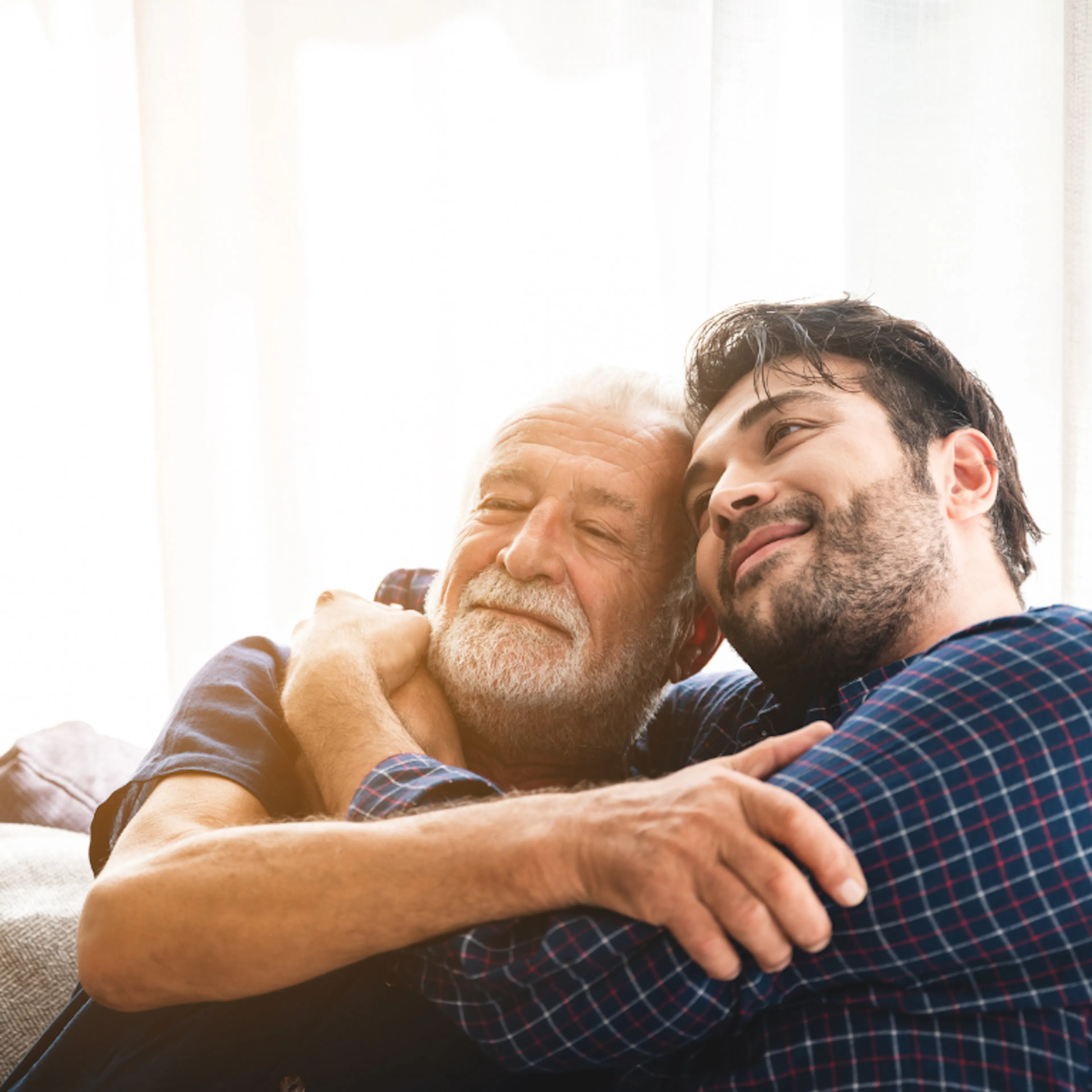 Father and son hugging, representing the ultimate father's day gift of time together