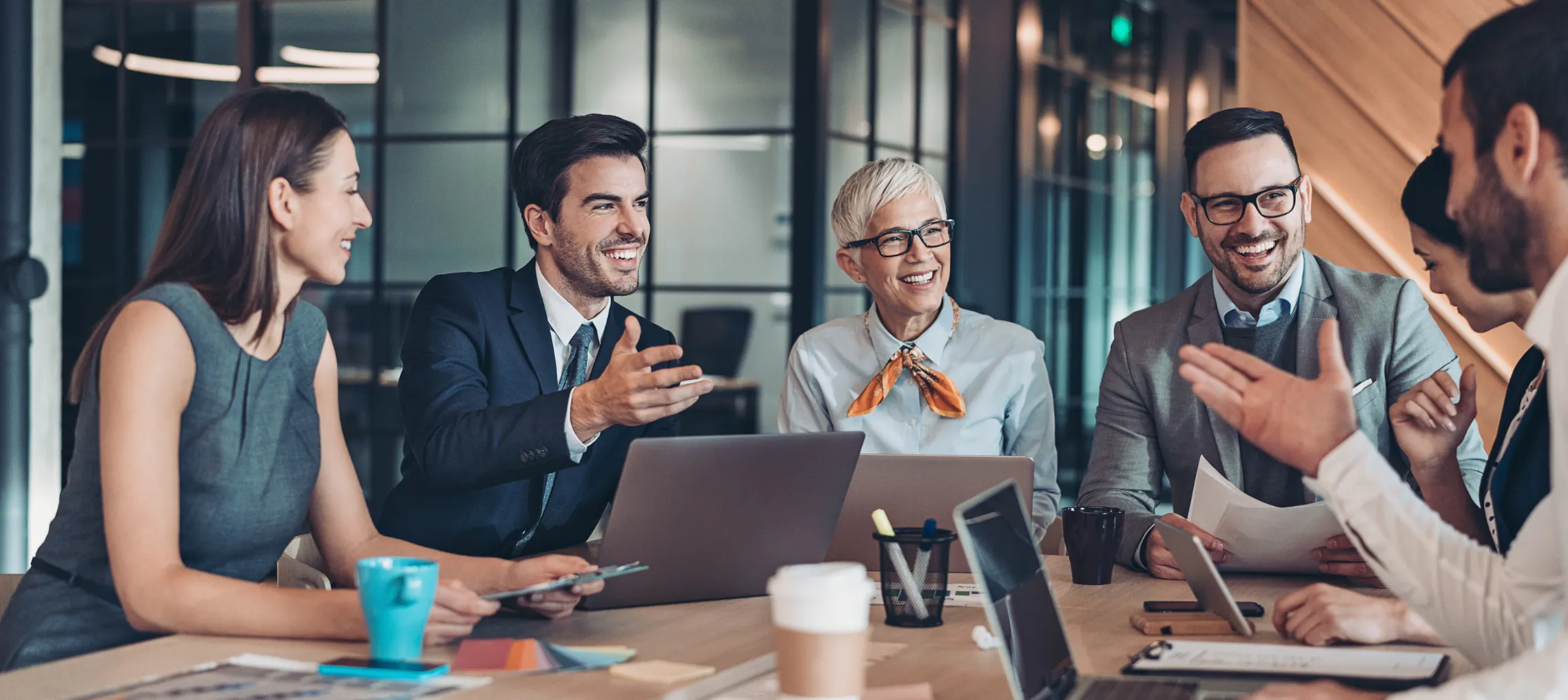 Administrative professional coordinating workplace celebration and building company culture in a boardroom meeting