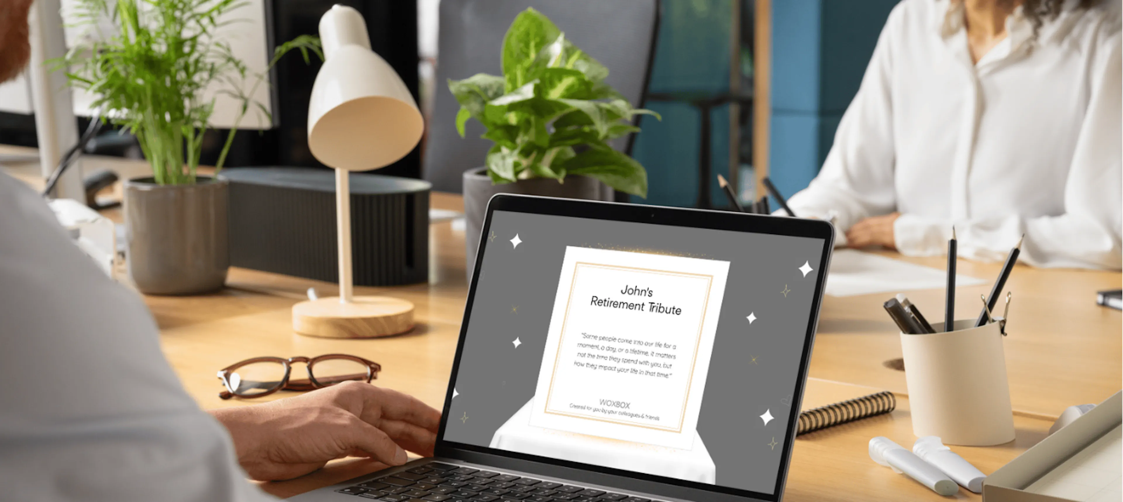 Workplace laptop on desk with retiring employee's Digi-Wox visible on screen