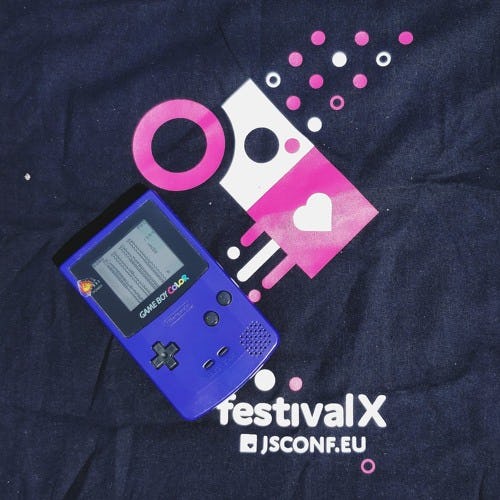 JSConf Festival X tote bag with a purple Game Boy Color placed on top