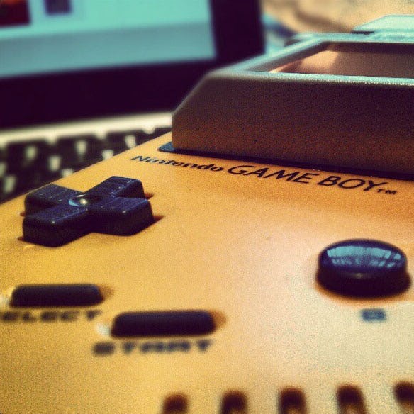 Close-up shot of a yellow Game Boy