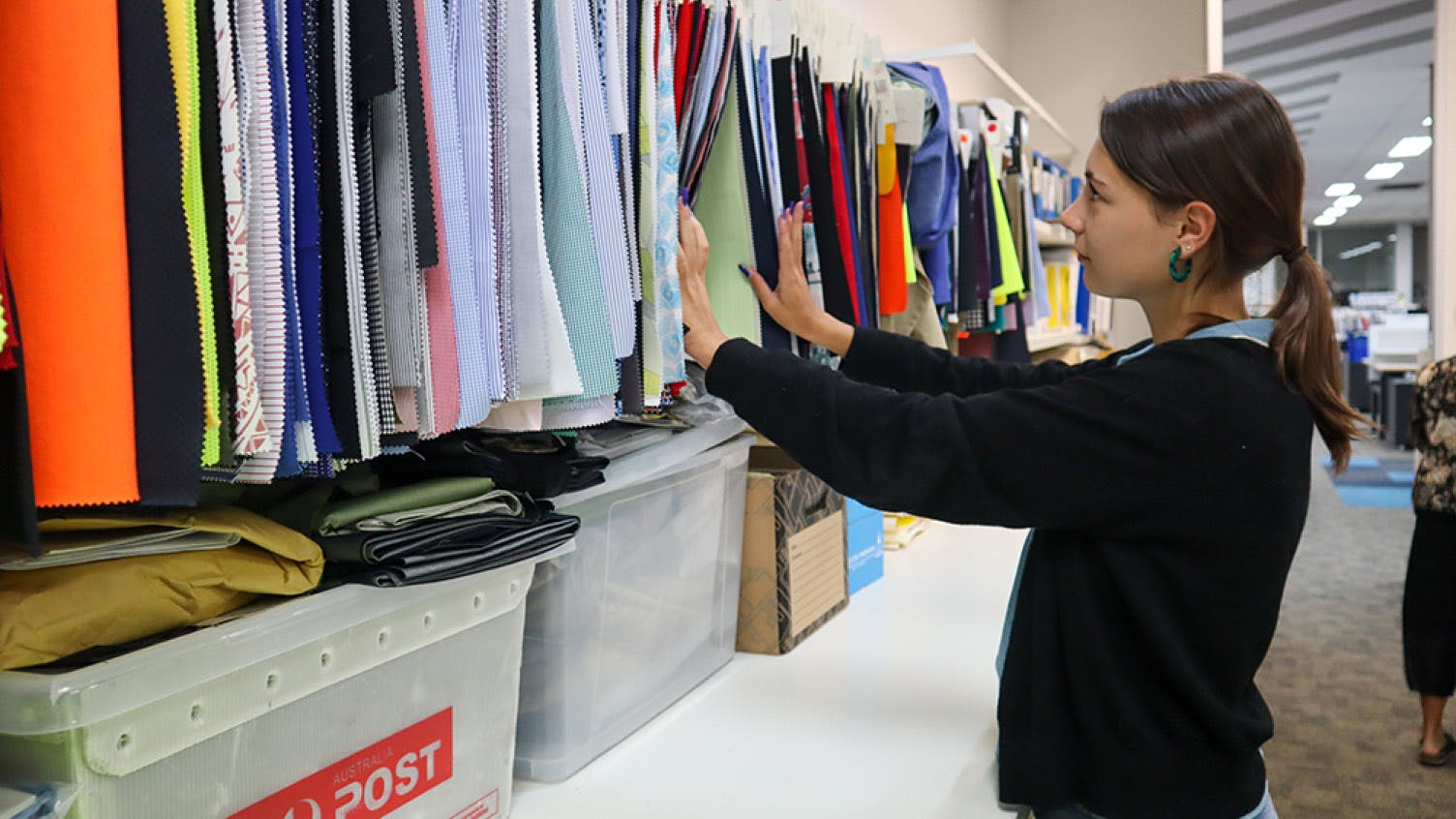 An employee looking through fabric samples