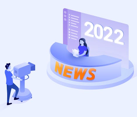Man video recording a woman sitting in front of a news desk in 2022
