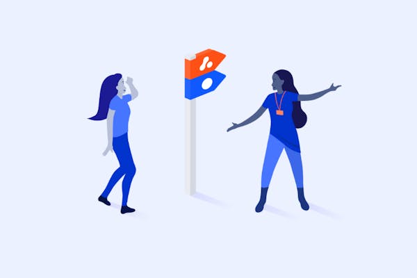 People pointing in a direction towards an Adaptavist and Atlassian sign