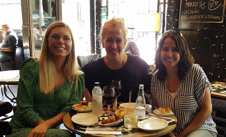 Indre with two female colleagues at lunch