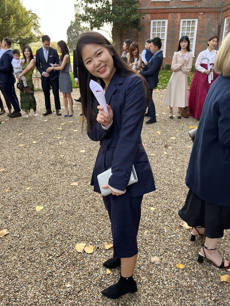 Jen smiling at a wedding