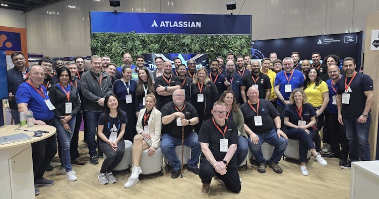 A picture of the Atlassian team and all the partners on the Atlassian stand