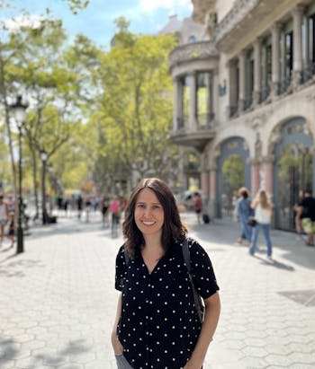 Míriam a product manager at Adaptavist, image of her smiling in Barcelona 