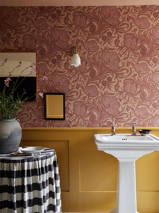 Bathroom with pink floral wallpaper (Poppy Trail - Masquerade) on the upper wall and yellow on the bottom half (Yellow-Pink)