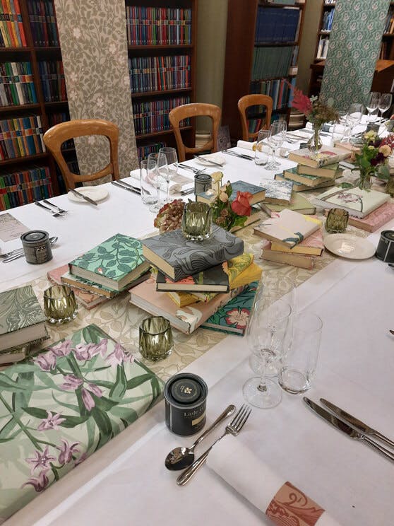 Table setting at the Geological Society in London featuring book centerpieces using National Trust Papers III patterns.