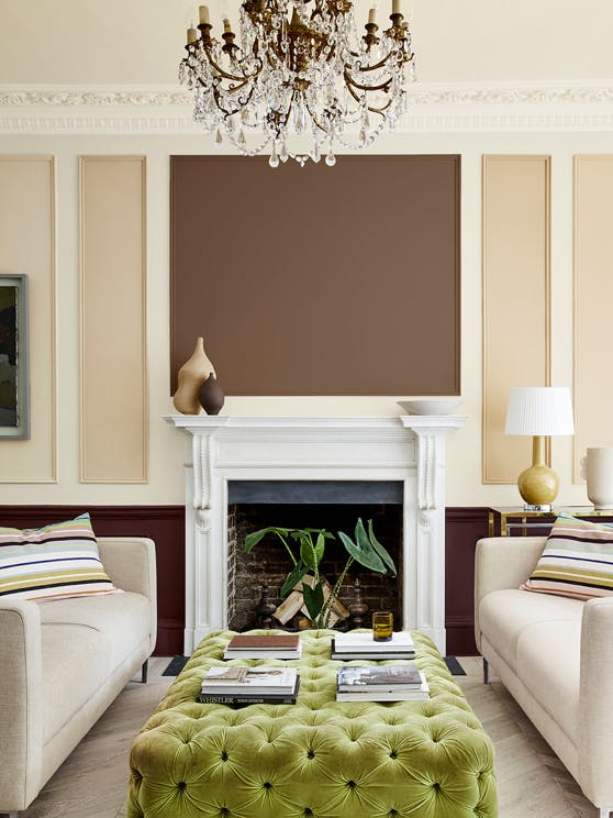 Sitting room with a neutral beige (Clay - Mid) wall and paneling in deep stone, pale brown and fawn colors, and two sofas.