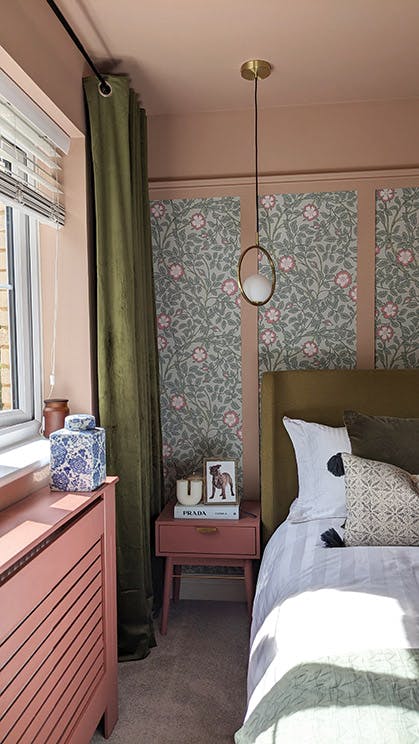Briar Rose - Salix wallpaper featured within pink panelling alongside pink walls, ceiling, radiator cover and side table.