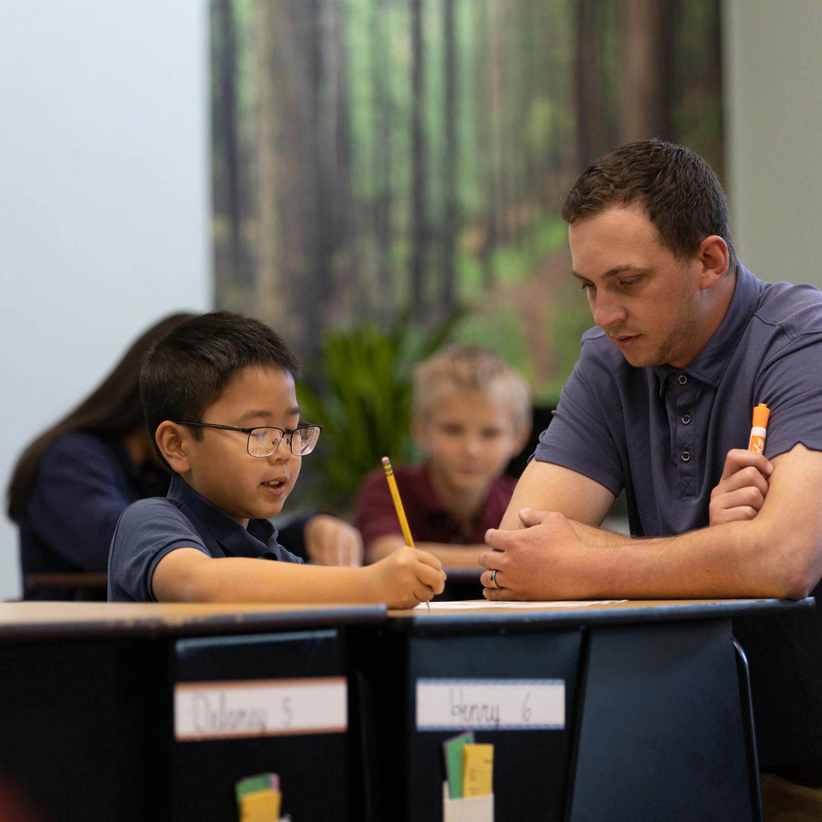 Student working with teacher