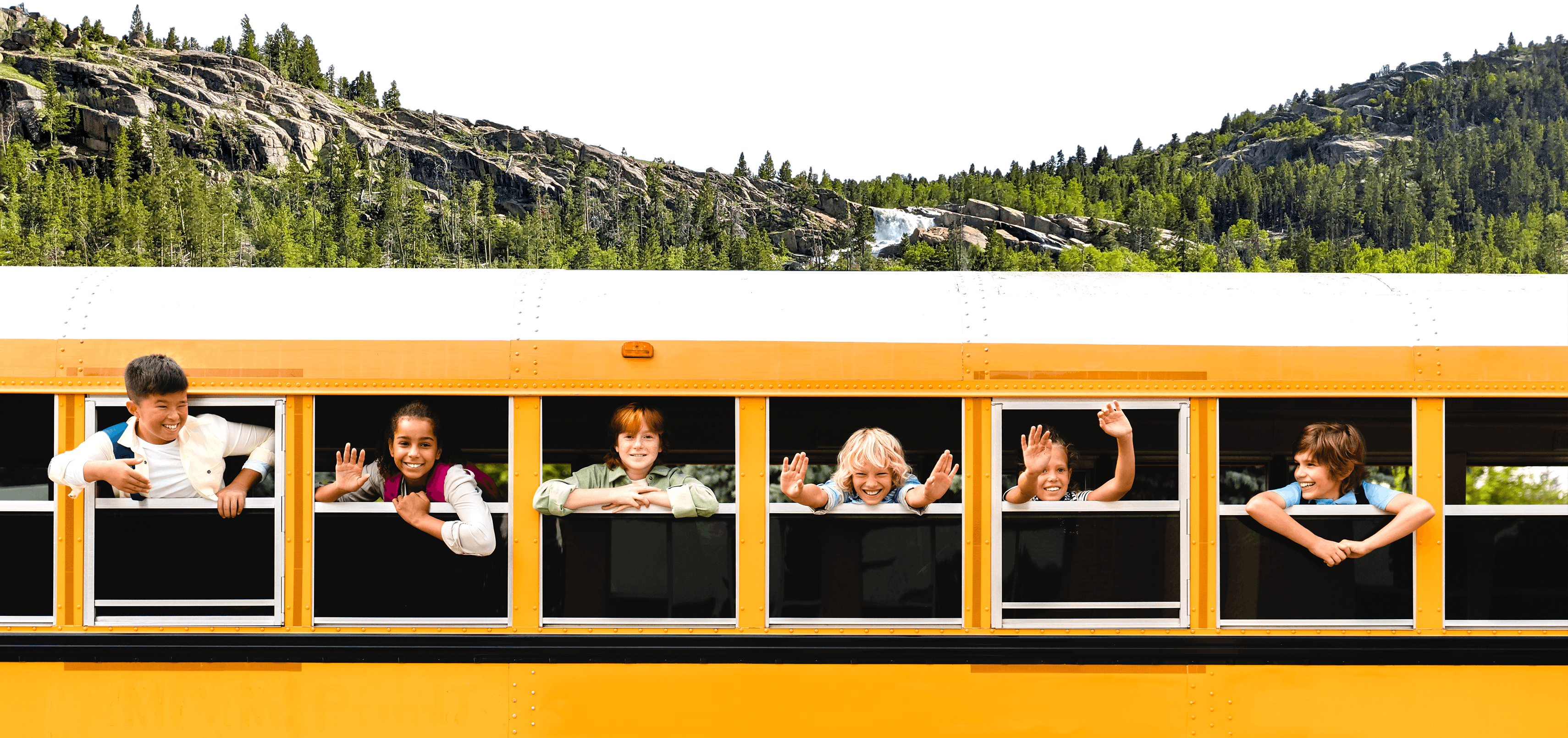 Students waving from a school bus
