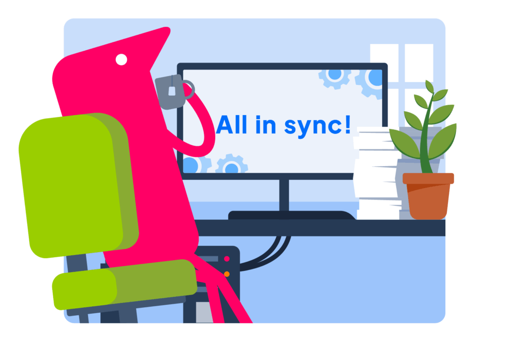 Texthelper foran computer med teksten "alt synkroniseret" på skærmen