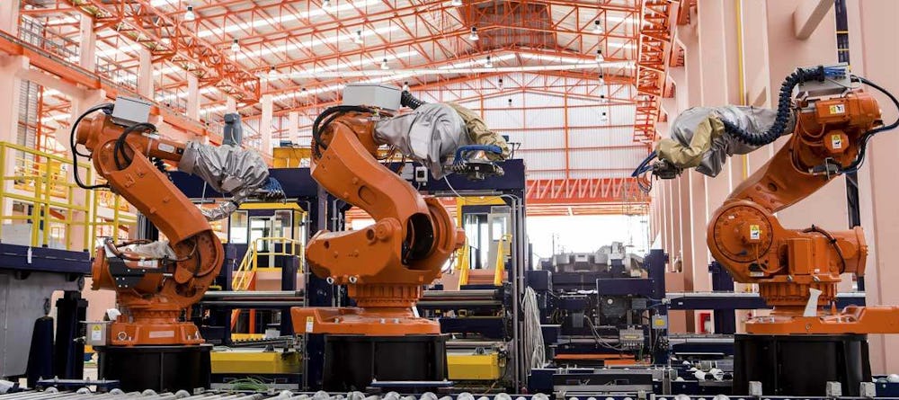 Large robots on assembly line