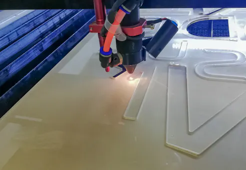 Laser cutting acrylic. Image Credit: Shutterstock.com/Openkomax