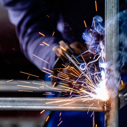 Metal welding with sparks. Image Credit: Shutterstock.com/DeawSS